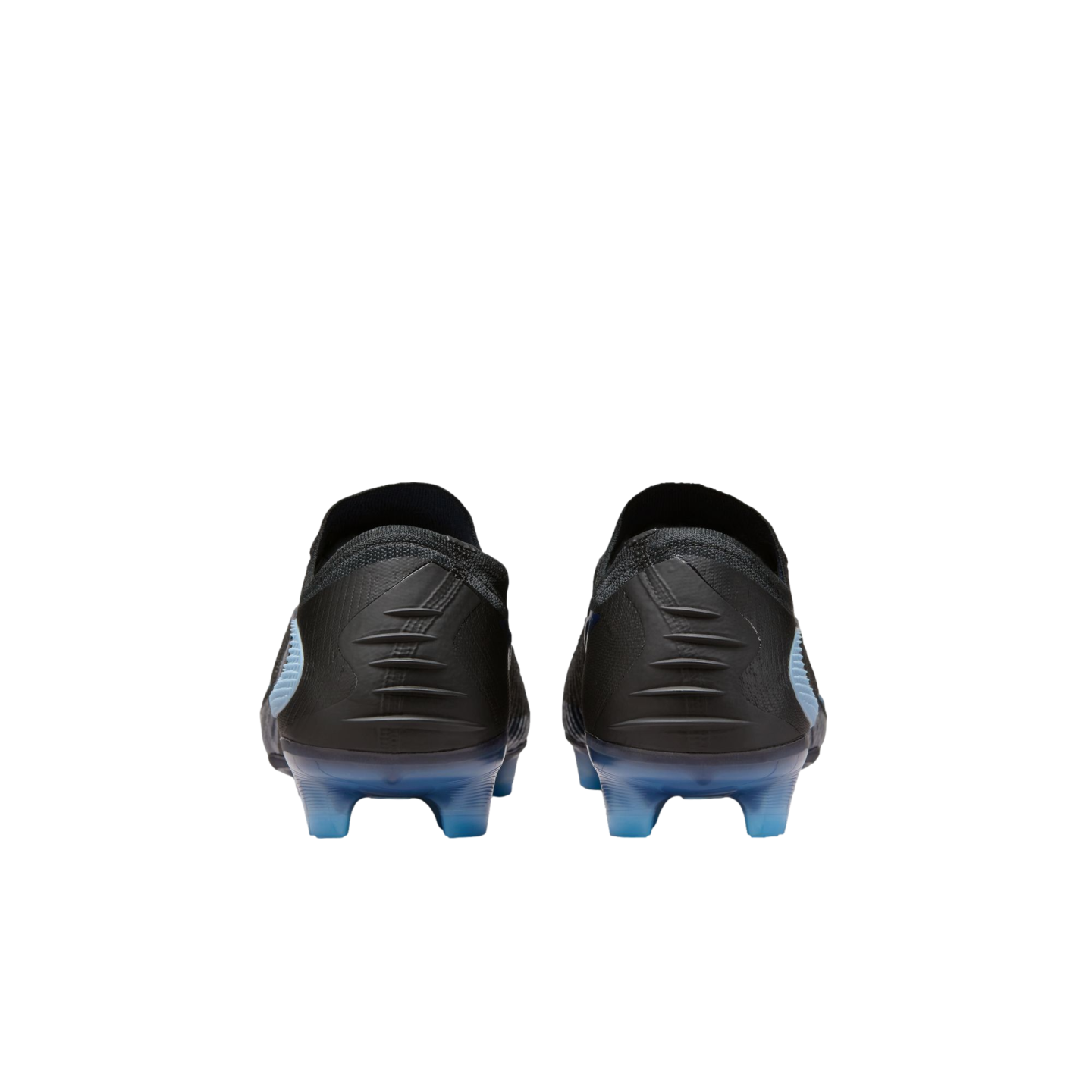 Back view of black soccer cleats with textured heels and translucent blue soles and studs against a black background.