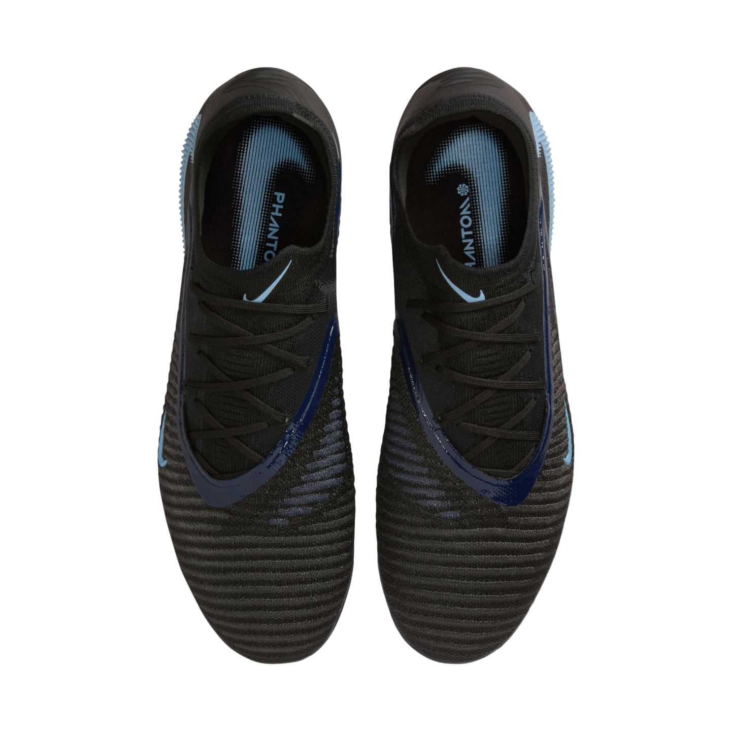Top-down view of black Nike Phantom soccer cleats with light blue accents and textured uppers on a black background.