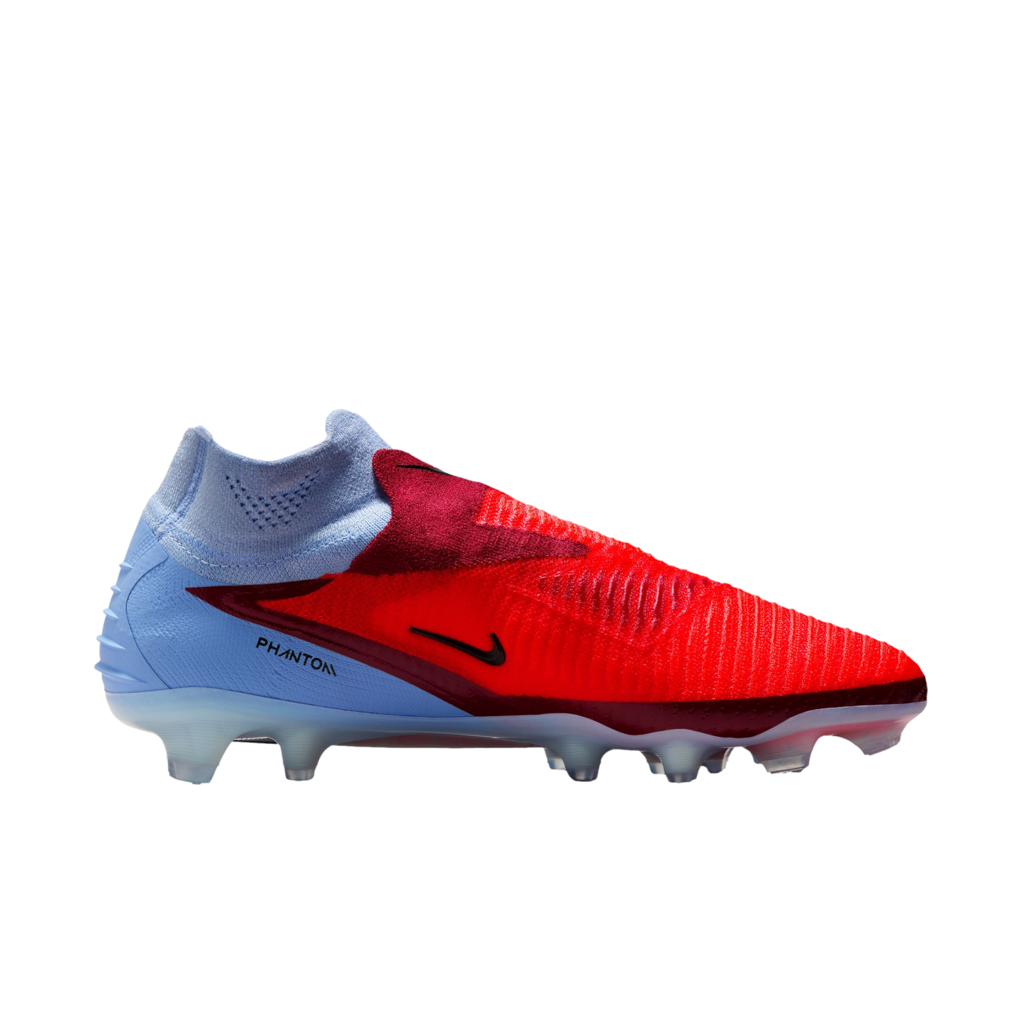 A Nike Phantom soccer cleat with a vibrant red forefoot and light blue heel, featuring a sock-like collar, shown against a solid black background.