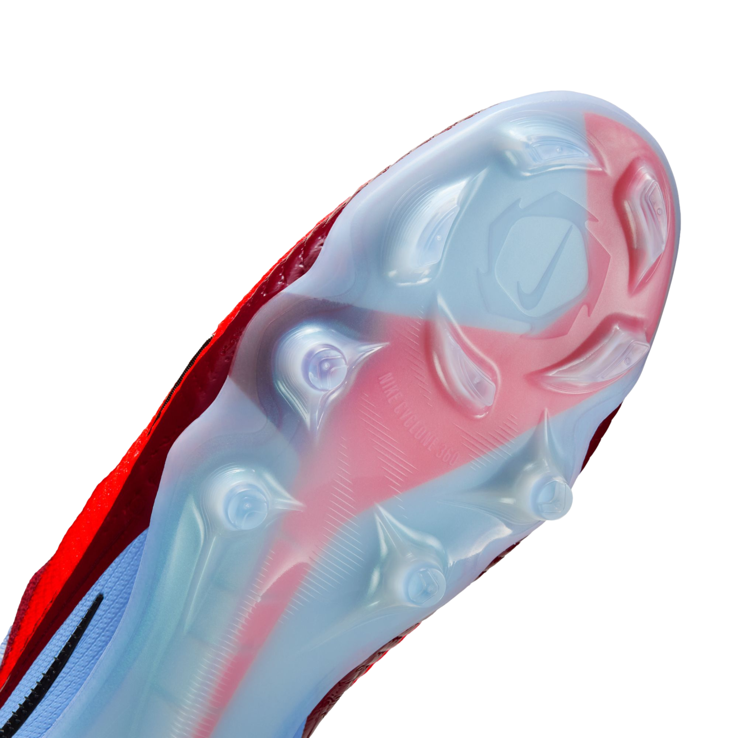 A close-up of a Nike soccer cleat's translucent soleplate with a red swoosh, showing the traction pattern and "NIKE CYCLONE 360" text against a black background.