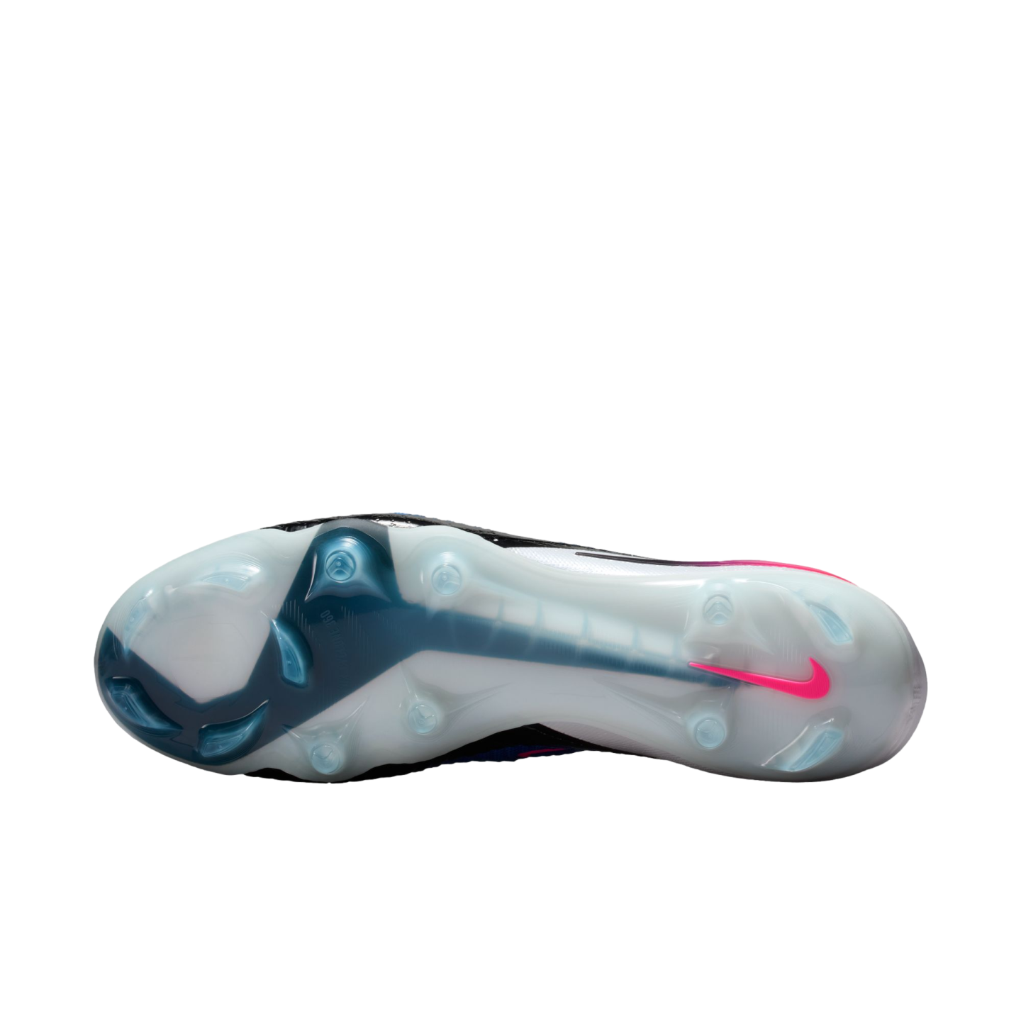 Bottom view of a Nike soccer cleat's translucent white and teal soleplate, featuring traction studs and a pink swoosh on the heel.