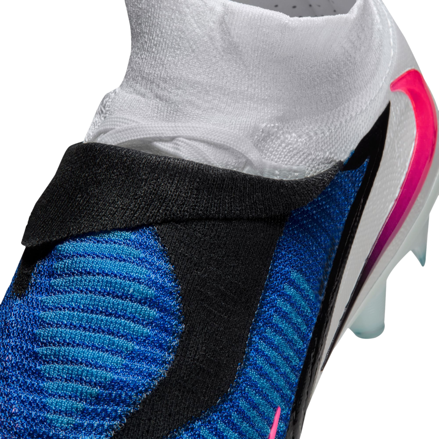Close-up of a blue, black, and white Nike soccer cleat featuring a textured upper and a knit ankle collar.