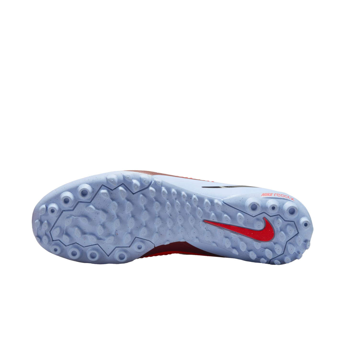 Light blue sole of a Nike turf soccer shoe with a textured pattern of small studs, a red swoosh logo on the heel, and "NIKE reactx" branding.