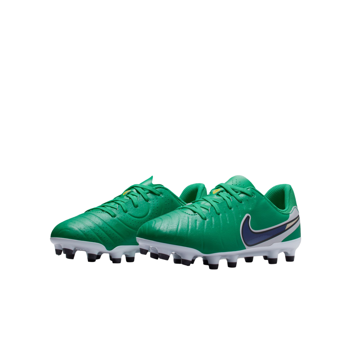 A pair of green Nike kids' soccer cleats with a navy blue swoosh and black studs, set against a plain white background.