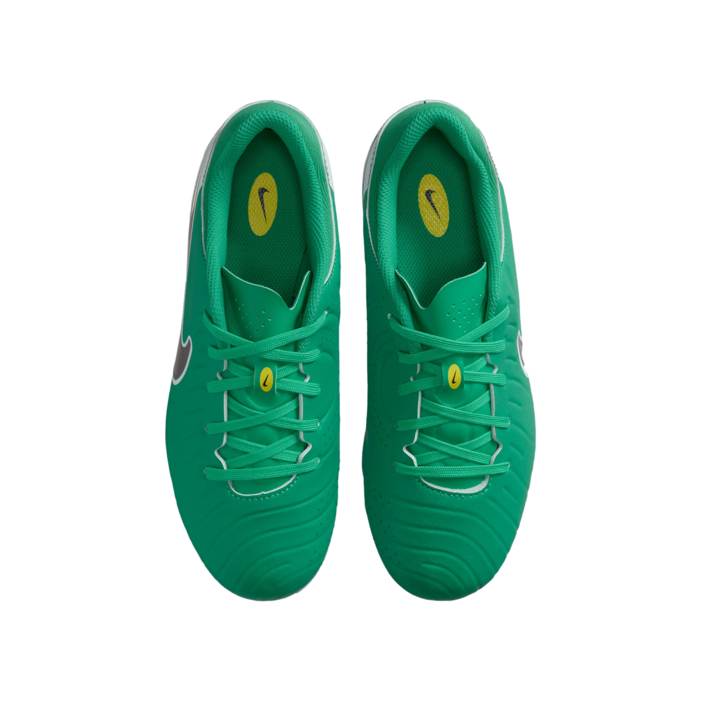 A top-down view of a pair of bright green Nike soccer cleats with matching laces and yellow brand logos on the tongue and insoles.