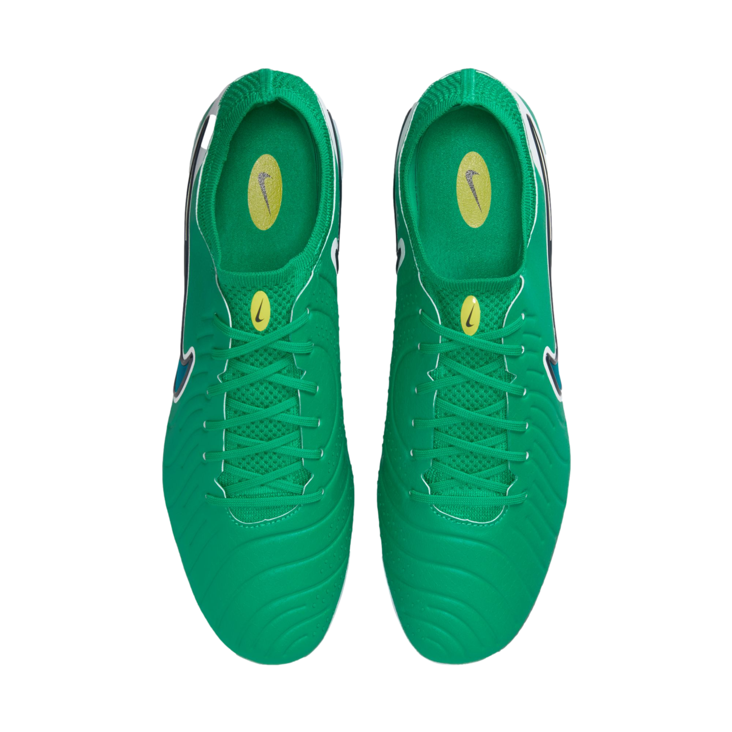 Top-down view of bright green Nike soccer cleats featuring textured uppers, matching green laces, and yellow logo accents on the tongues and insoles, shown on a white background.