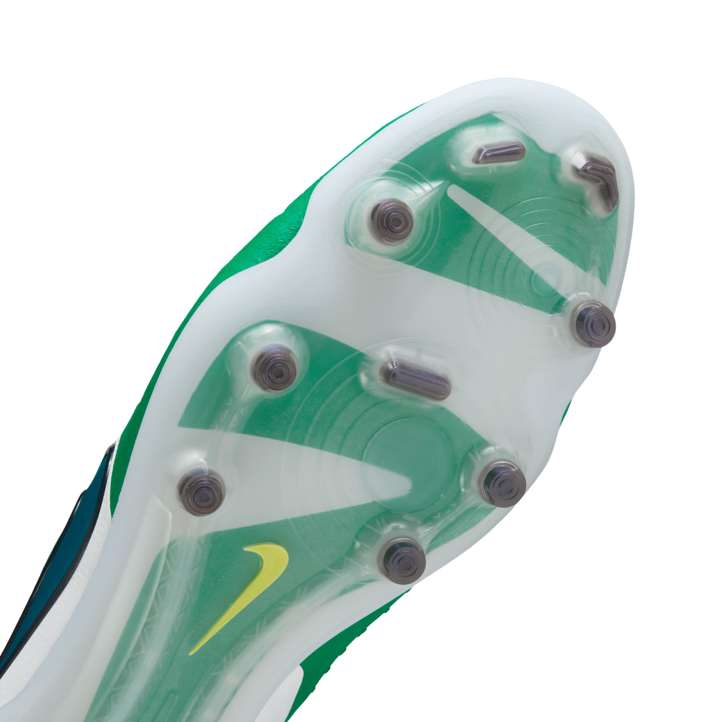Close-up bottom view of a Nike soccer cleat featuring a translucent soleplate with green and white designs, metal-tipped studs, and a small yellow swoosh logo.