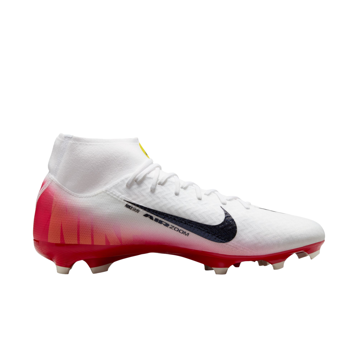 A profile view of a white Nike Air Zoom Mercurial soccer boot with a red-pink gradient heel, black swoosh, and textured upper, isolated on a black background.