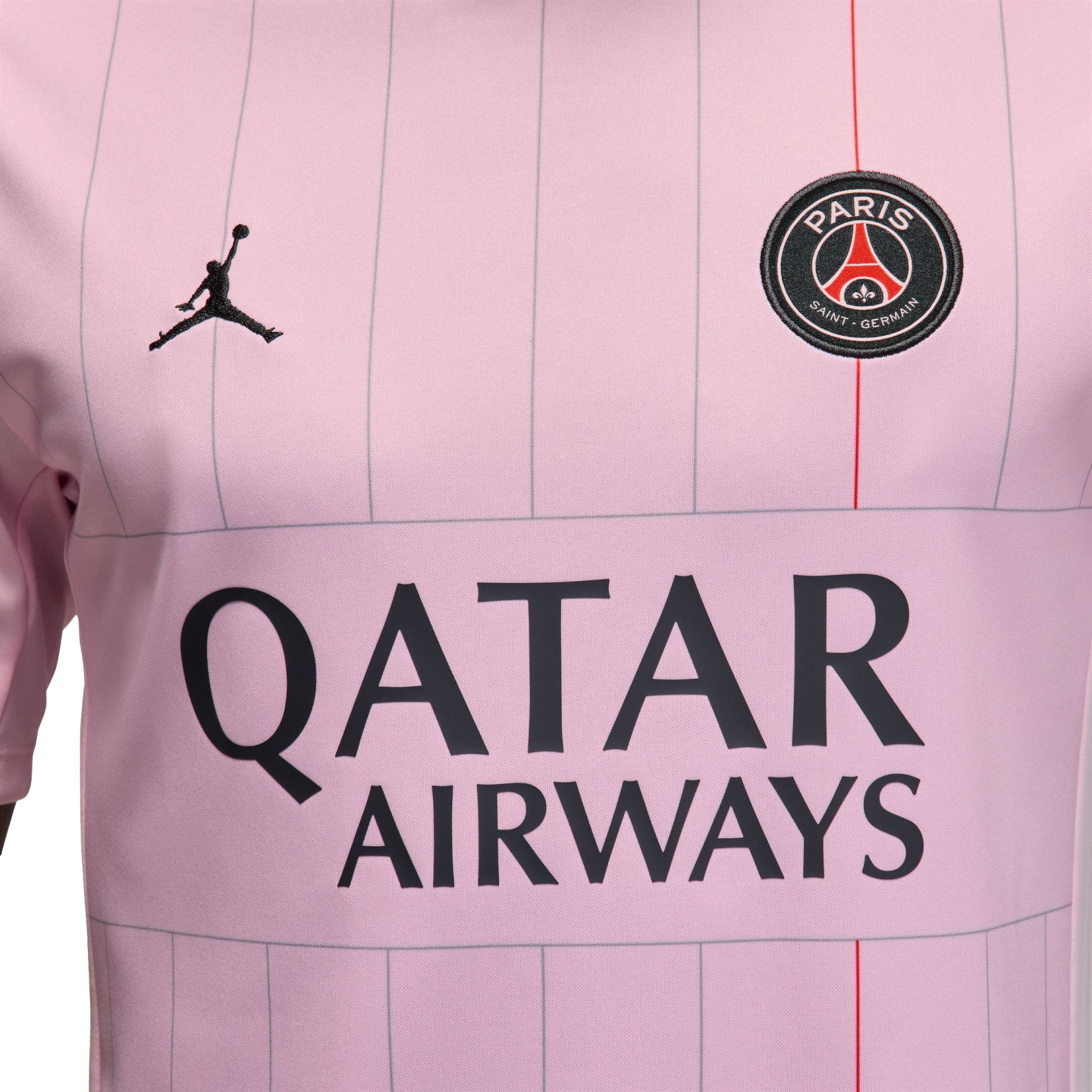 Close-up of a light pink PSG soccer jersey with vertical pinstripes, the Jordan logo, club crest, and "QATAR AIRWAYS" sponsor name.