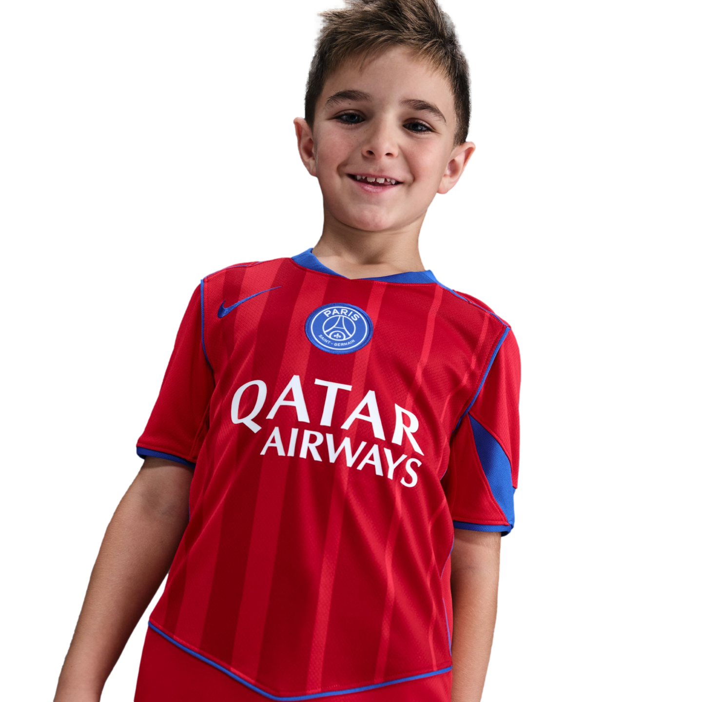 Smiling young boy wearing a red and blue Paris Saint-Germain soccer jersey with a Qatar Airways sponsor logo.