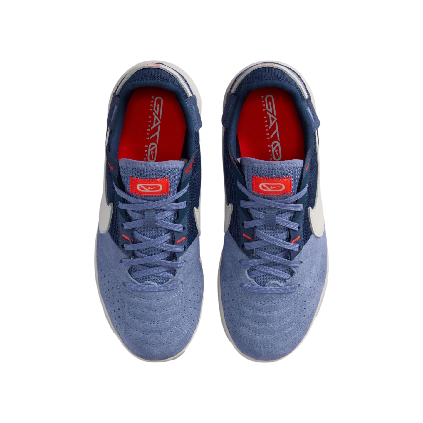 Top-down view of a pair of Nike Street Gato sneakers in light and dark blue with white accents and red insoles on a white background.