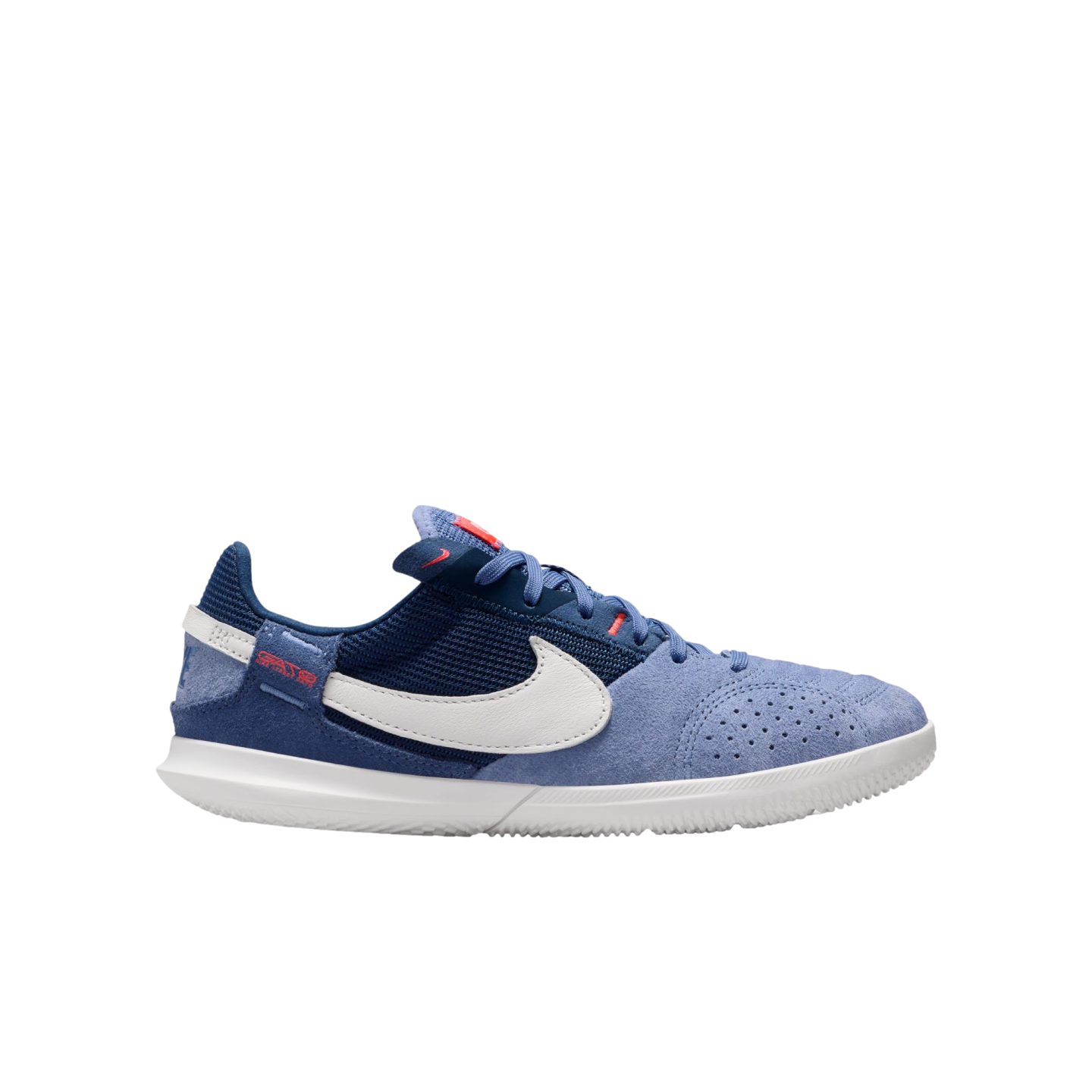 Side profile of a blue Nike sneaker featuring suede and mesh panels, a white swoosh, and a white rubber sole.