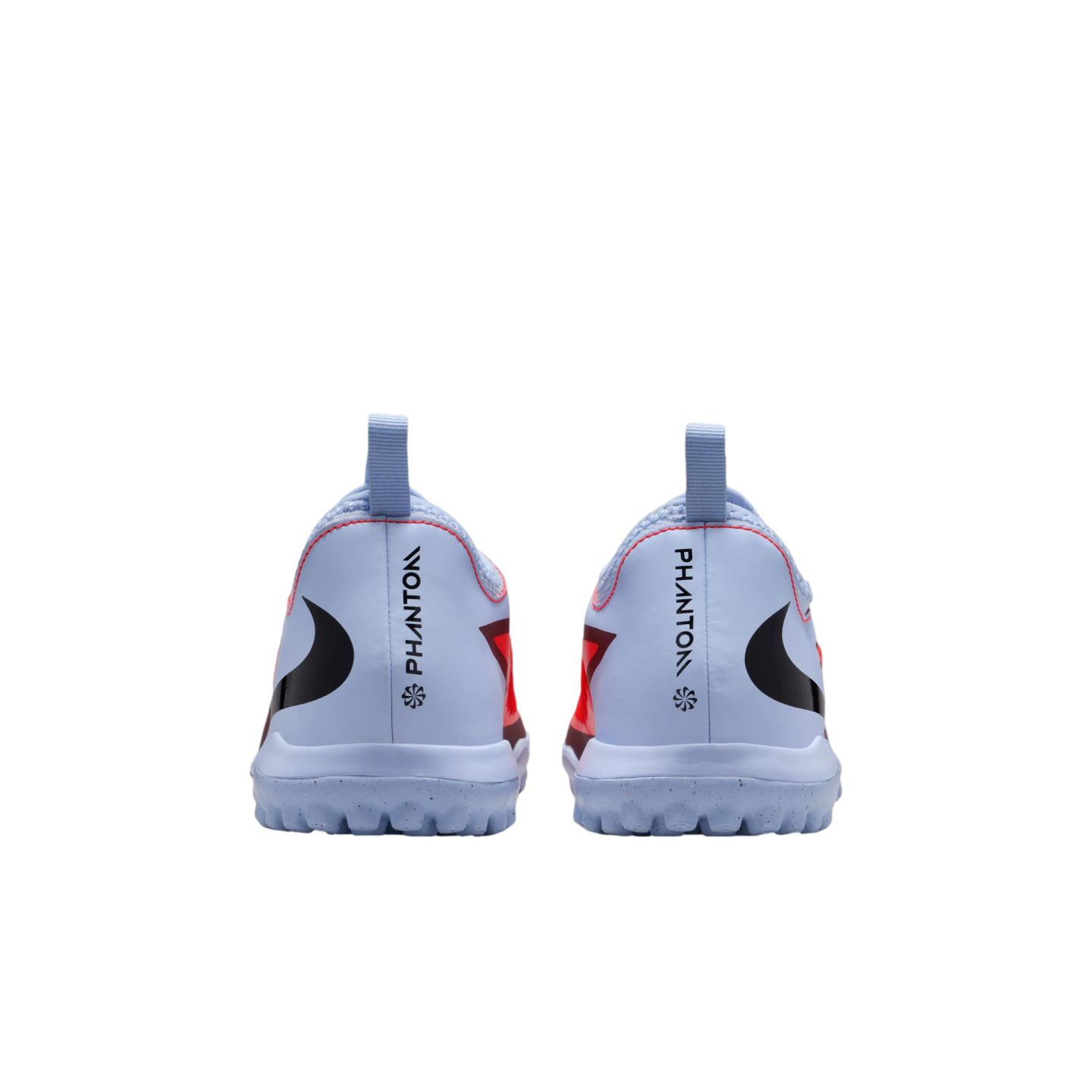 Rear view of light blue Nike Phantom soccer turf shoes with black swoosh logos and red accents against a black background.