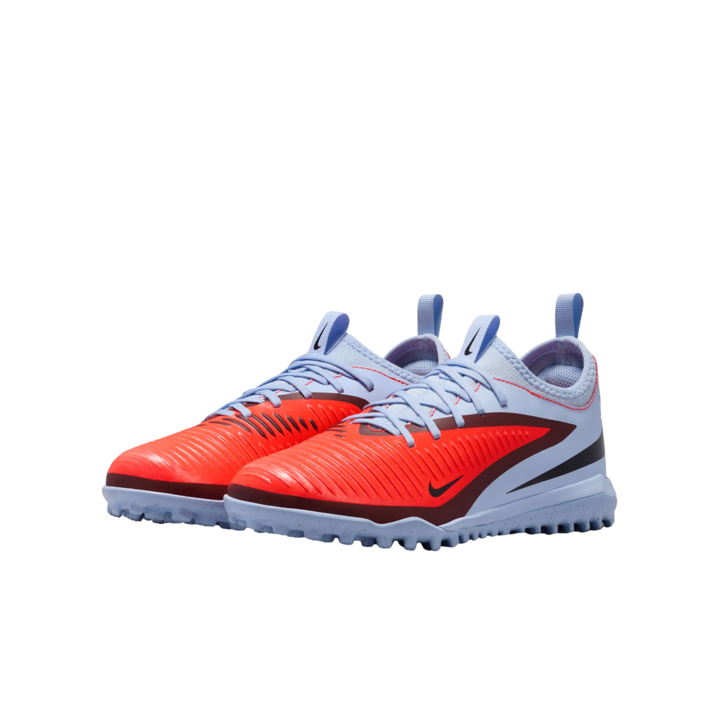 Pair of Nike turf soccer shoes in vibrant orange and light blue with black accents, shown against a solid black background.
