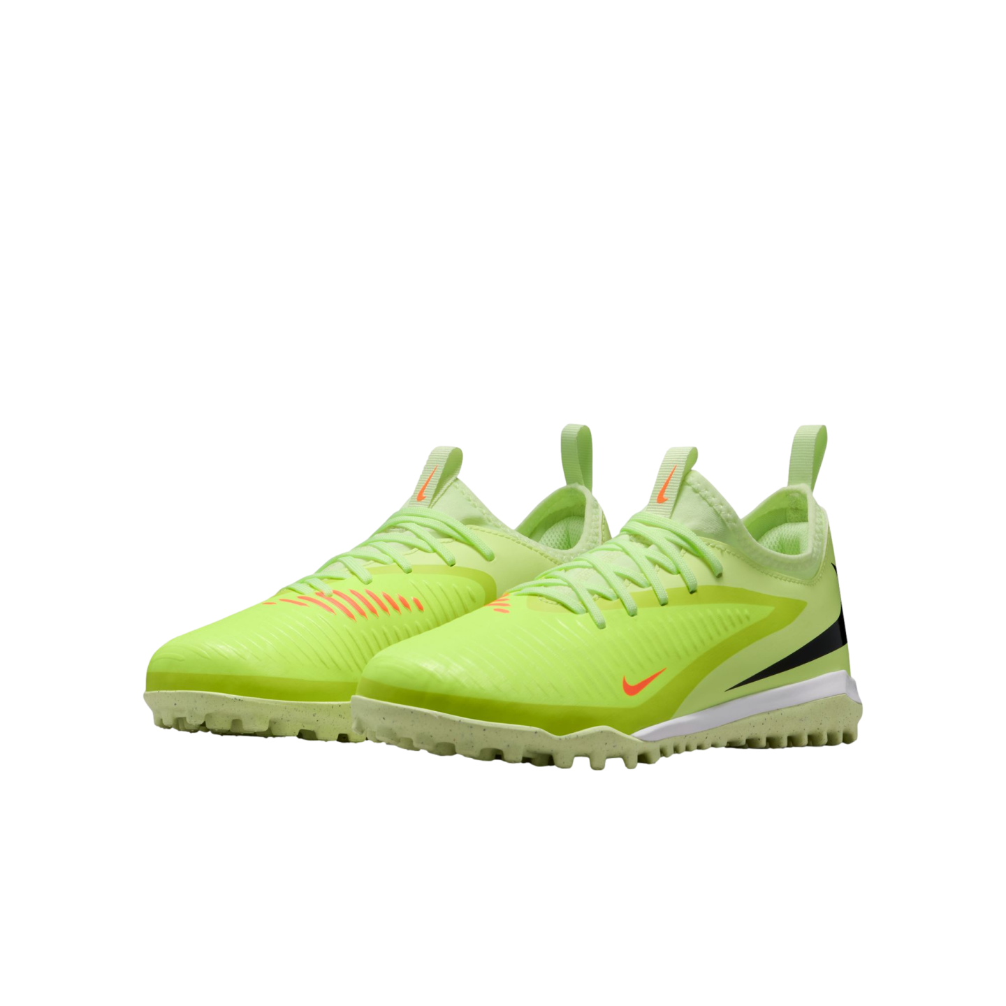Pair of lime green Nike turf soccer shoes featuring orange accents and a speckled white midsole against a black background.