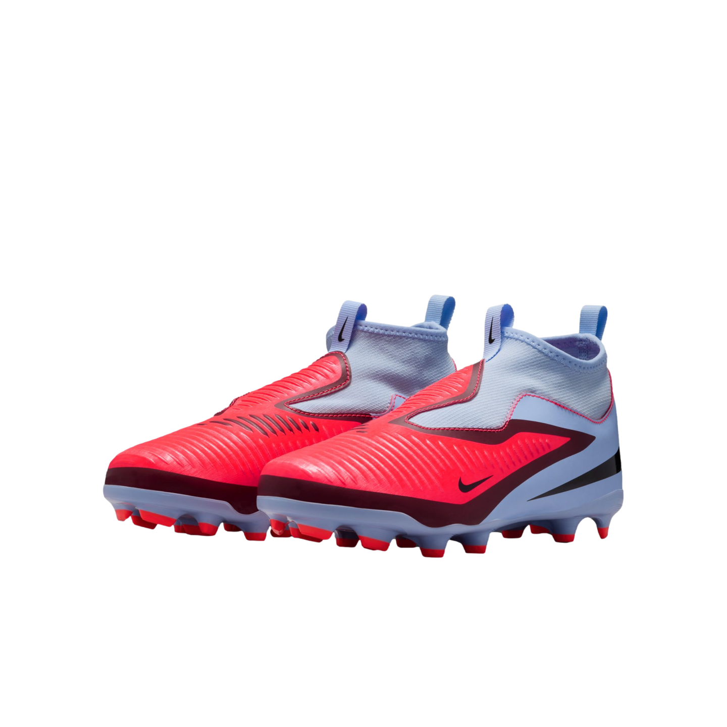A pair of bright red and light blue Nike laceless football cleats with high-top sock collars, set against a black background.