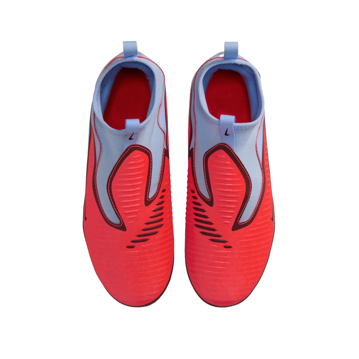 Top-down view of vibrant red and light blue Nike laceless soccer cleats on a black background.