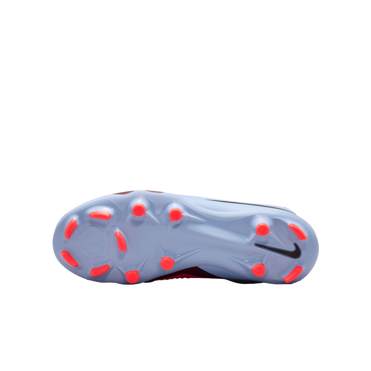 Bottom view of a light blue Nike soccer cleat with bright orange studs and a black Swoosh logo.