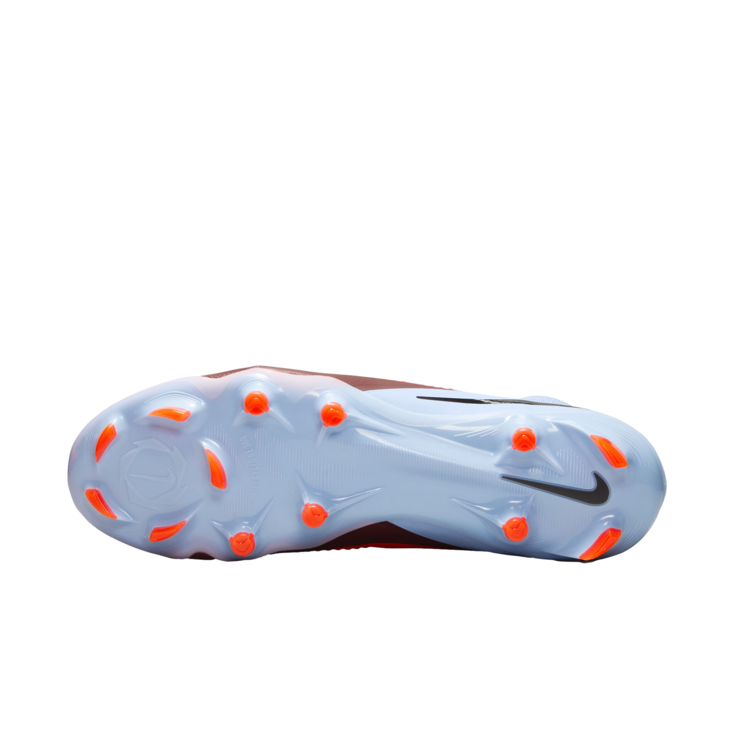 The light blue soleplate of a Nike soccer cleat featuring bright orange studs and a black swoosh on the heel, displayed against a black background.
