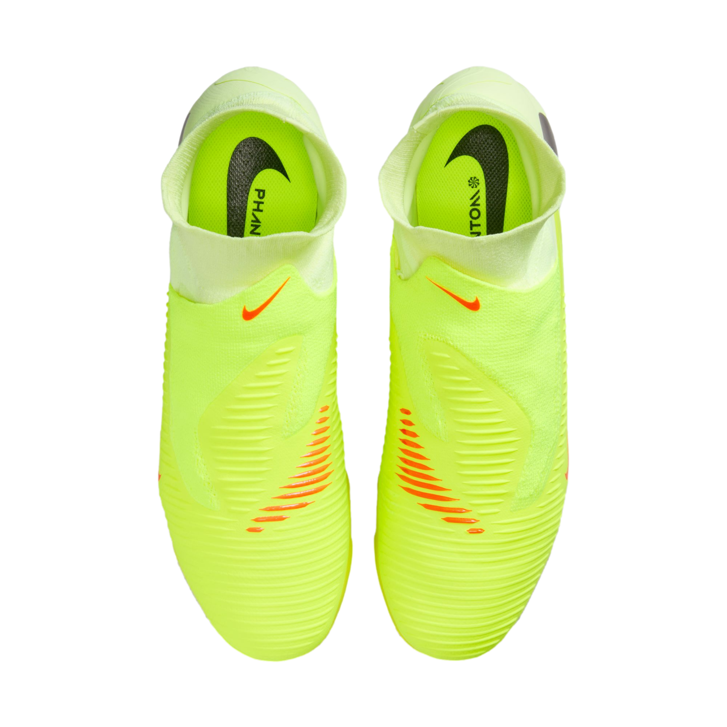 Top-down view of neon yellow Nike Phantom laceless soccer cleats on a black background, featuring orange accents and black Nike logos on the insoles.