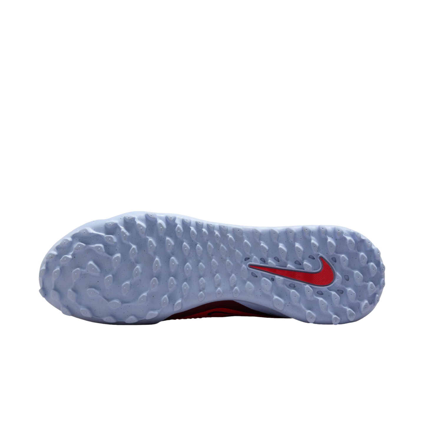Sole of a light blue Nike turf shoe with small traction studs and a red swoosh logo, shown on a black background.