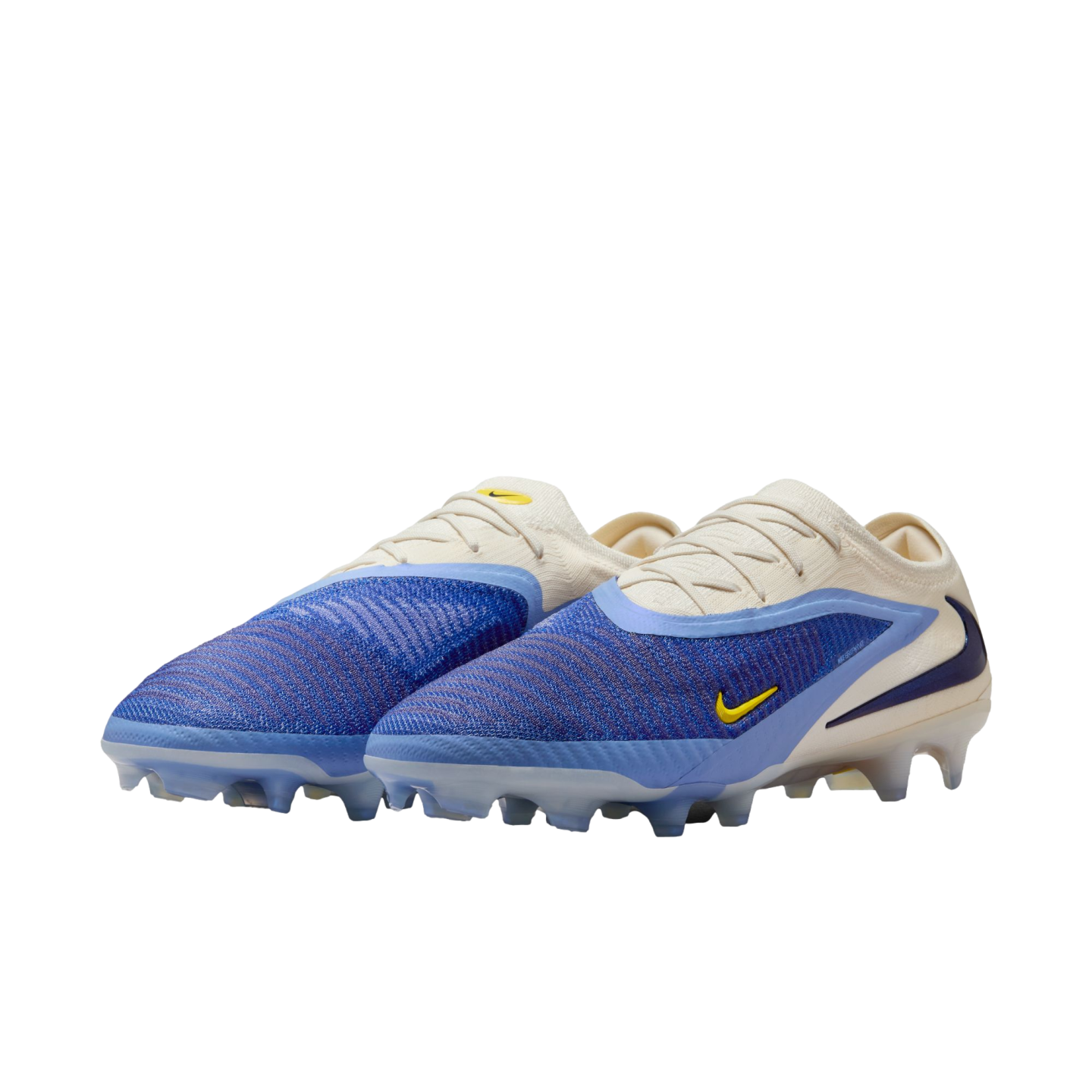A pair of Nike soccer cleats featuring a textured blue forefoot, cream-colored heel and laces, and small yellow Nike swooshes.