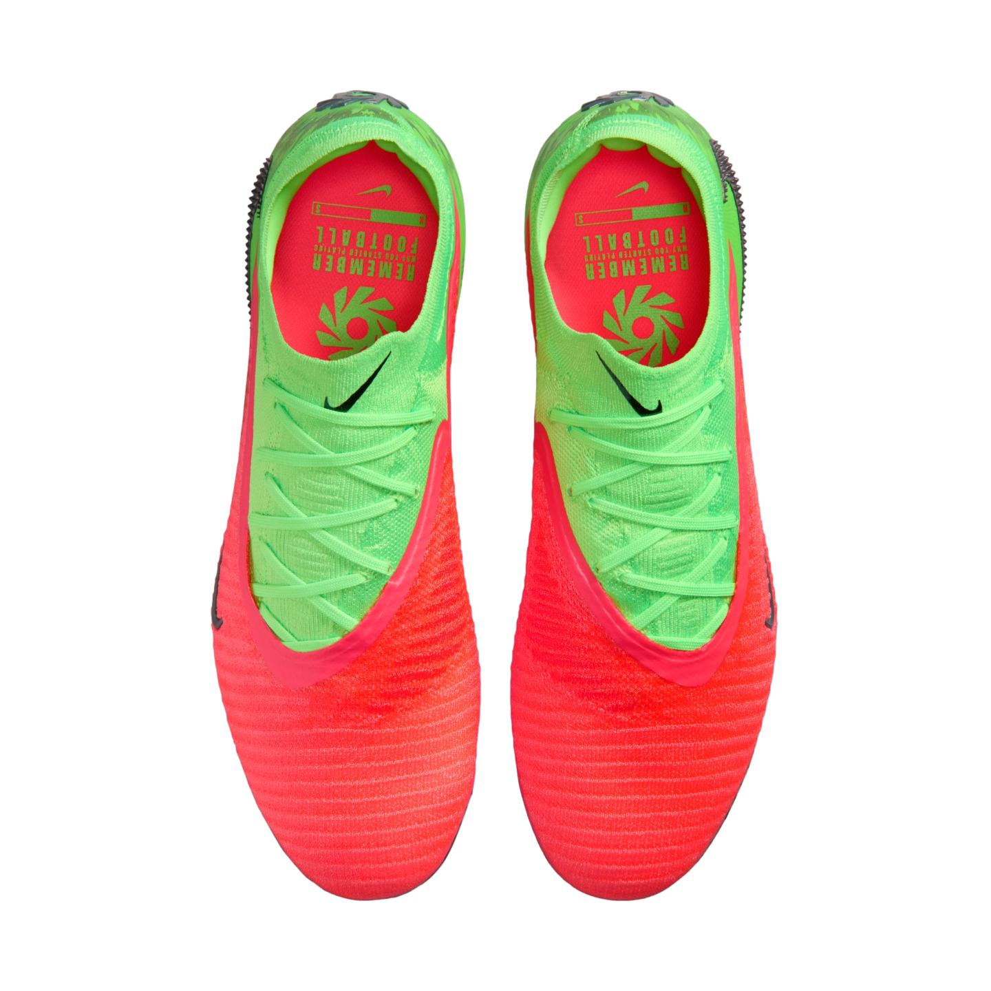 A top-down view of a pair of Nike soccer cleats featuring a vibrant neon orange and lime green color scheme. The shoes have a textured orange toe that transitions into a lime green heel with matching green laces. The interior is bright orange with green t