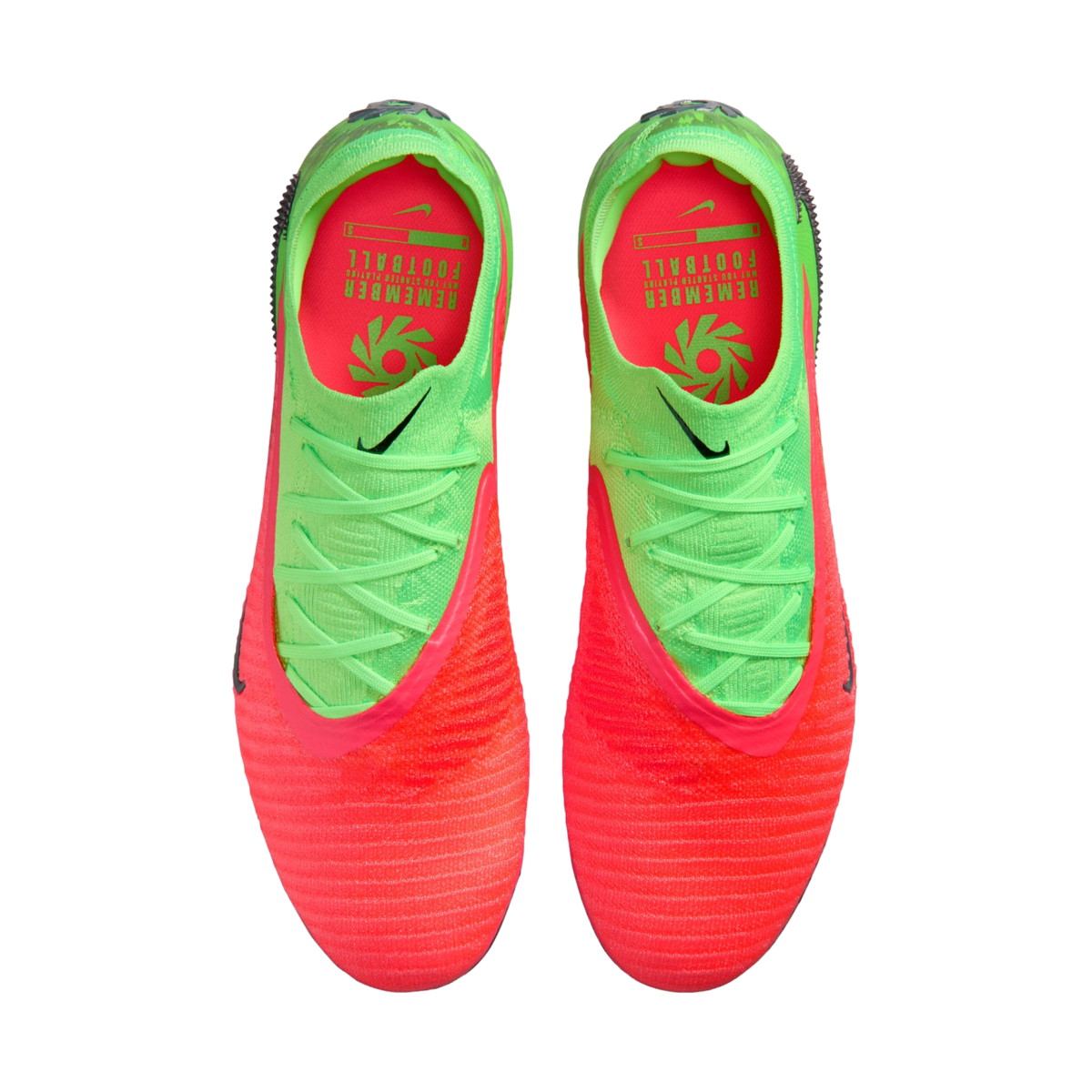 A top-down view of a pair of Nike soccer cleats featuring a vibrant neon orange and lime green color scheme. The shoes have a textured orange toe that transitions into a lime green heel with matching green laces. The interior is bright orange with green t