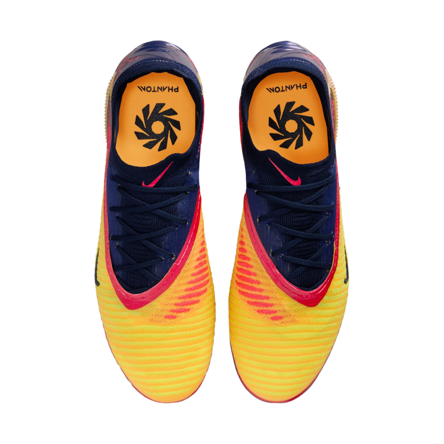 Top-down view of a pair of vibrant yellow, orange, and blue Nike Phantom football boots against a black background.