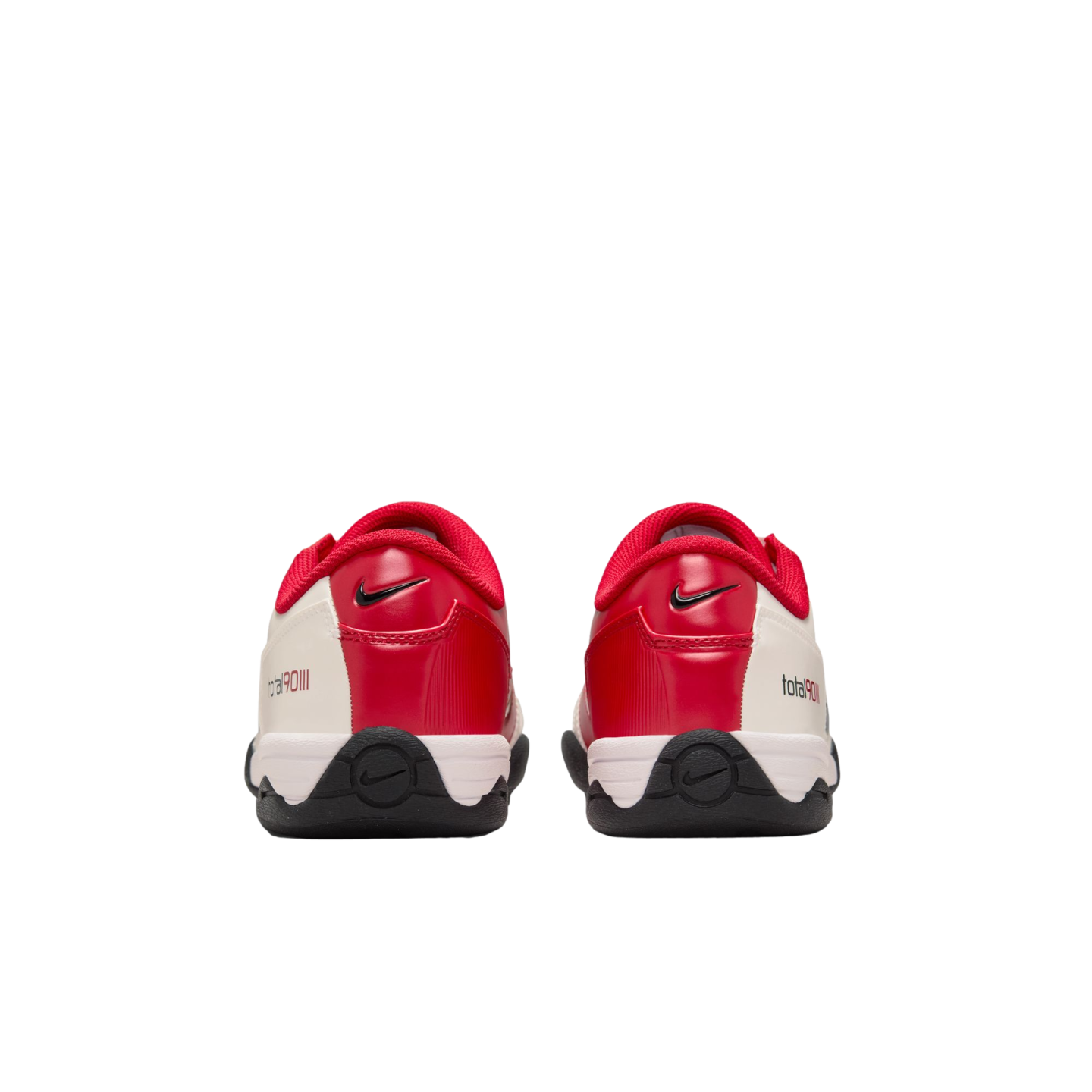 Rear view of a pair of red and white Nike Total 90 III indoor soccer shoes against a white background.