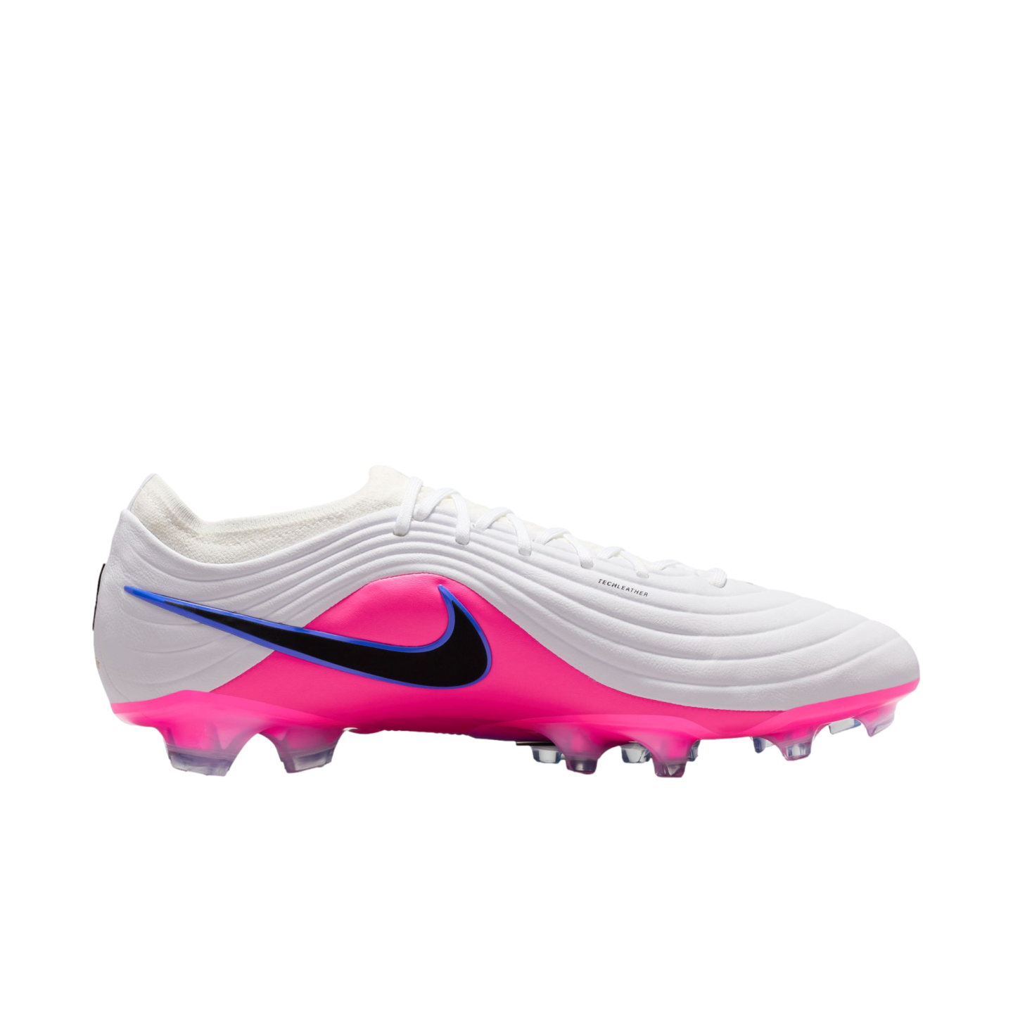 A white and bright pink Nike soccer cleat with a black swoosh and ridged texture, shown from the side against a black background.