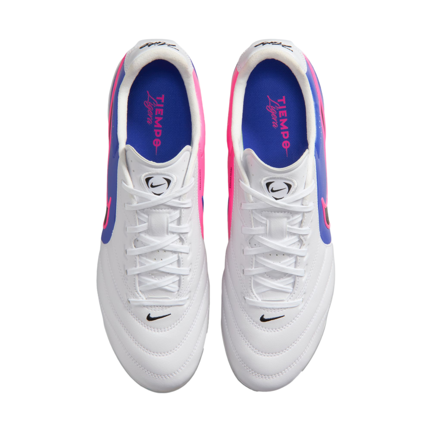 Top-down view of a pair of white Nike Tiempo Ligera soccer cleats with pink and blue side accents and blue insoles.