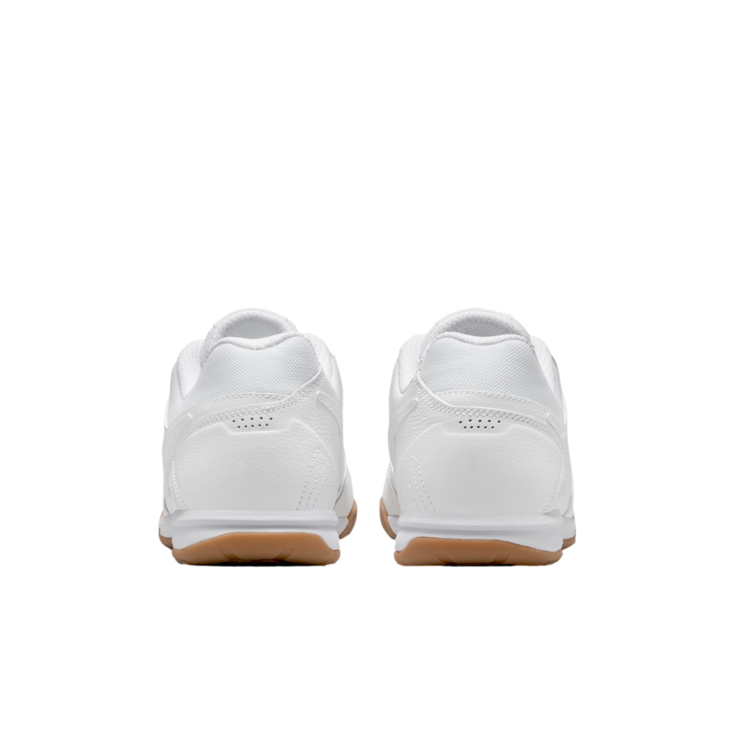 Rear view of a pair of white athletic shoes with tan gum soles, isolated against a black background.