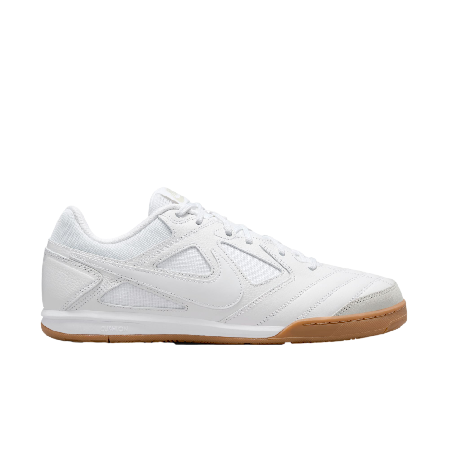 Profile of a white Nike indoor soccer shoe with a mesh and leather upper and a gum rubber outsole, set against a black background.