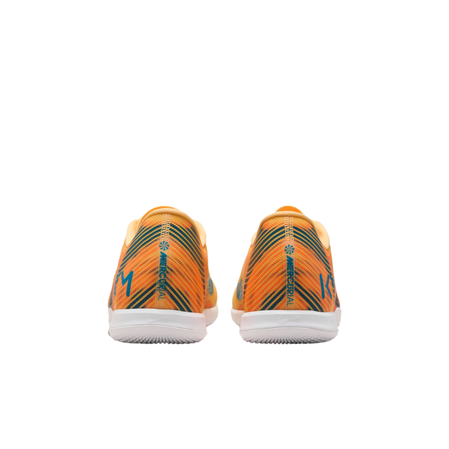 Back view of orange Nike Mercurial soccer shoes featuring blue diagonal stripes, white soles, and "KM" branding on the heels.
