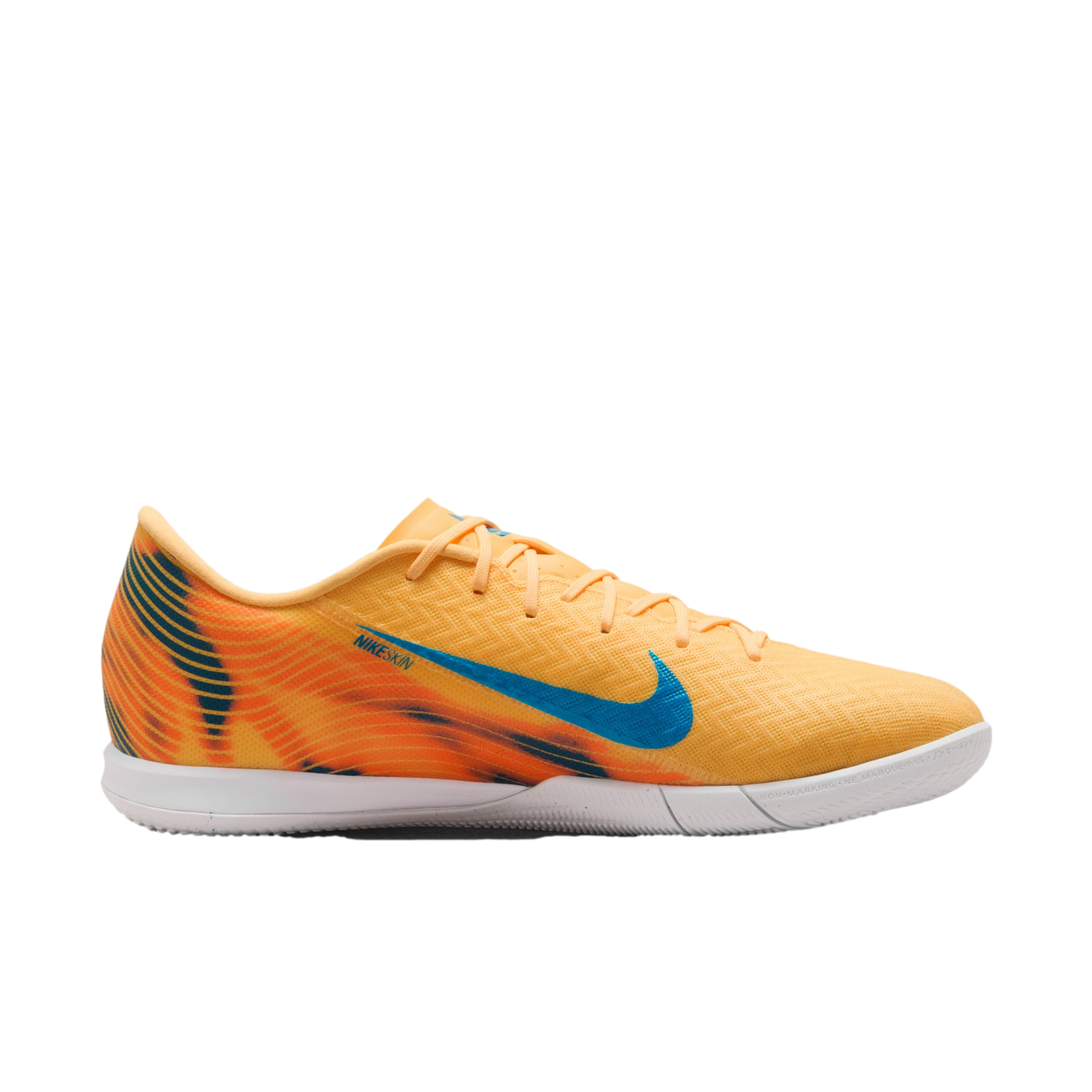 Bright orange Nike indoor soccer shoe with a blue swoosh and flame-patterned heel on a black background.