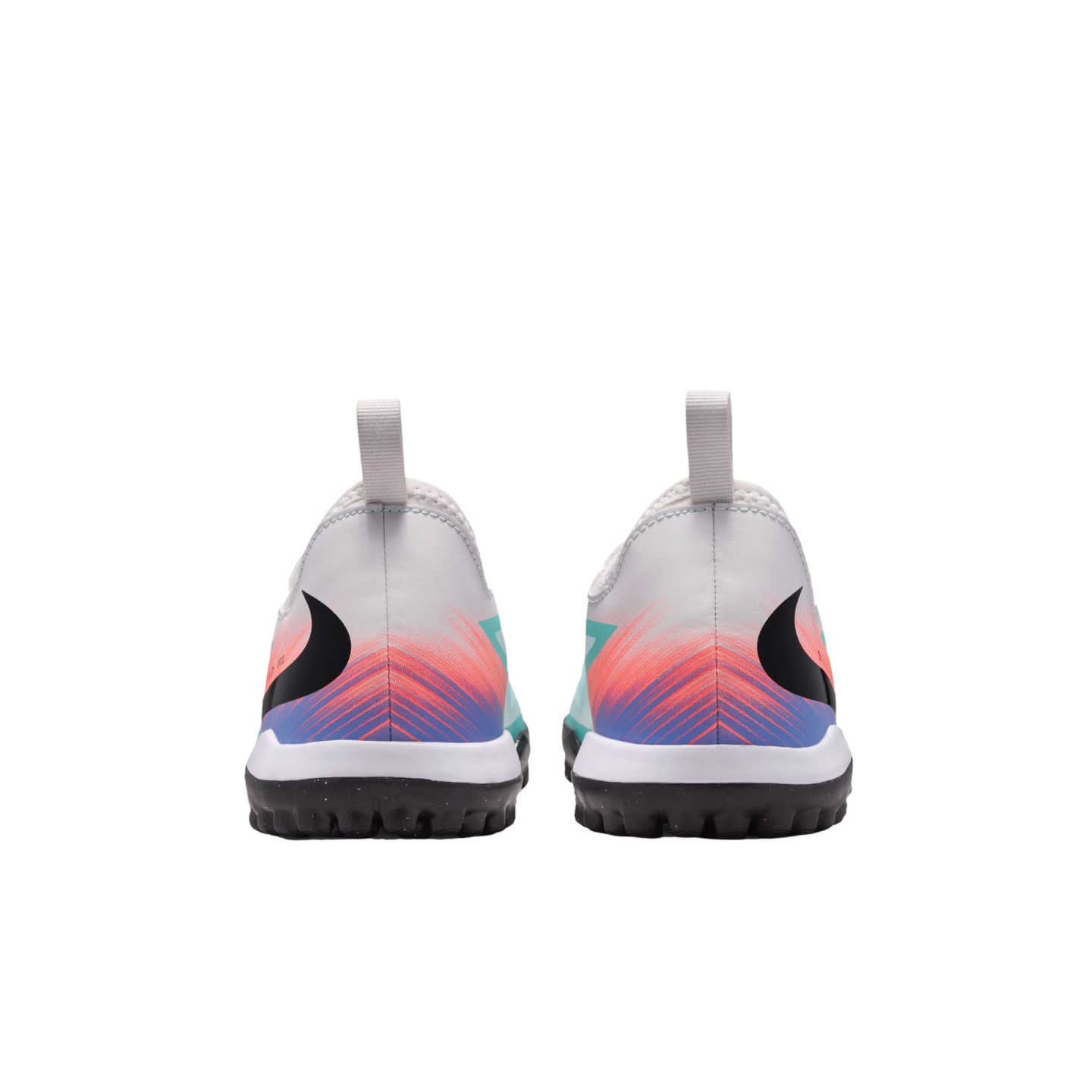 Rear view of white Nike turf shoes featuring a vibrant orange and blue gradient pattern on the heels and black studded soles against a solid black background.