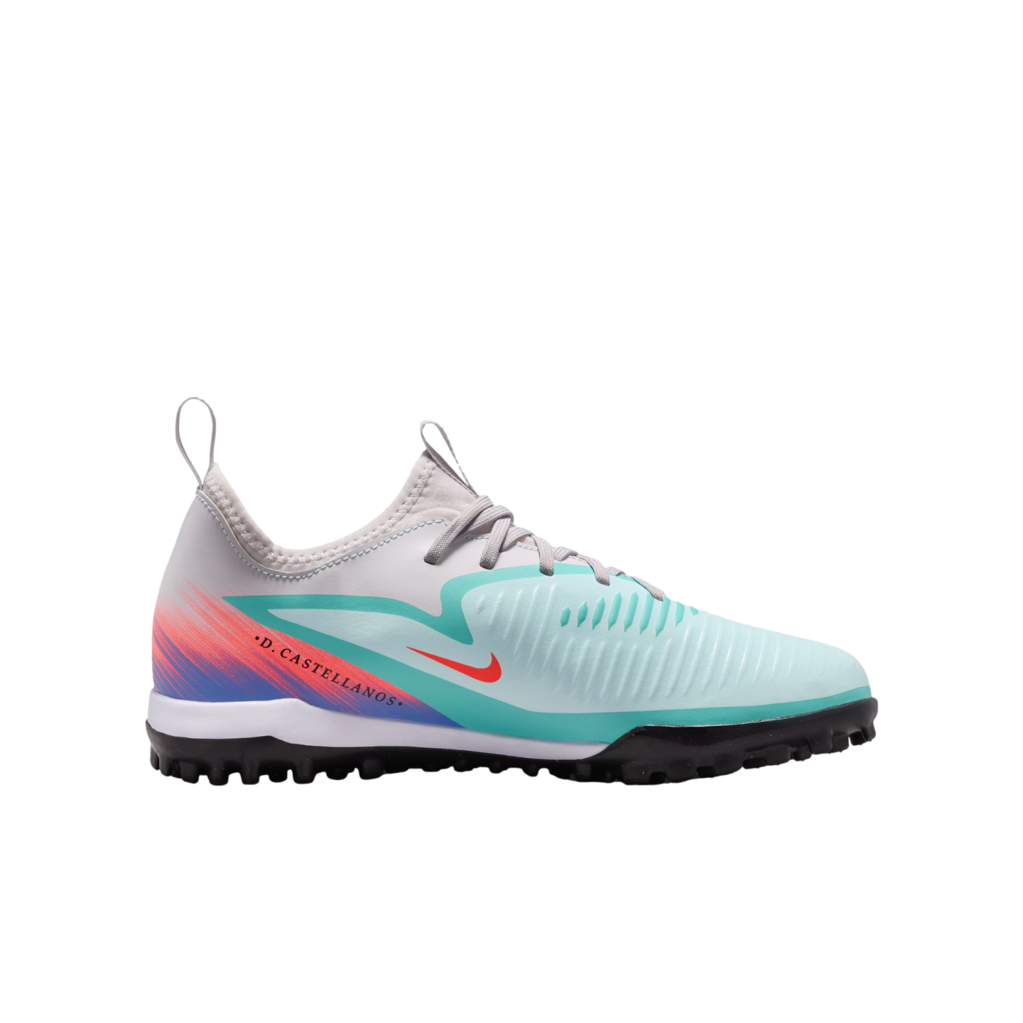 Profile view of a Nike turf soccer shoe with a teal and grey upper, purple/orange gradient, and "D. CASTELLANOS" printed on the side. It has a black rubber studded outsole.
