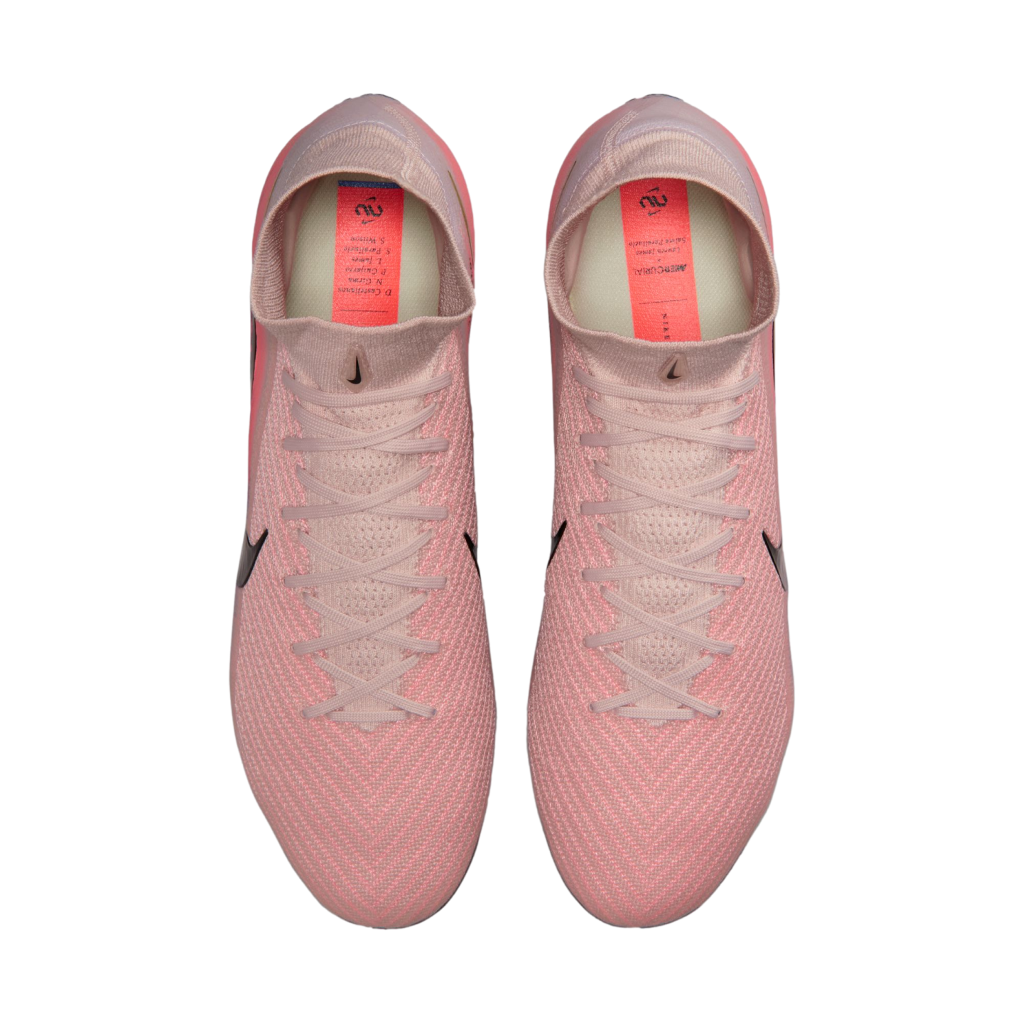 Top-down view of pink Nike Mercurial soccer cleats on a black background, featuring a textured upper, high-top collar, and black swoosh details.
