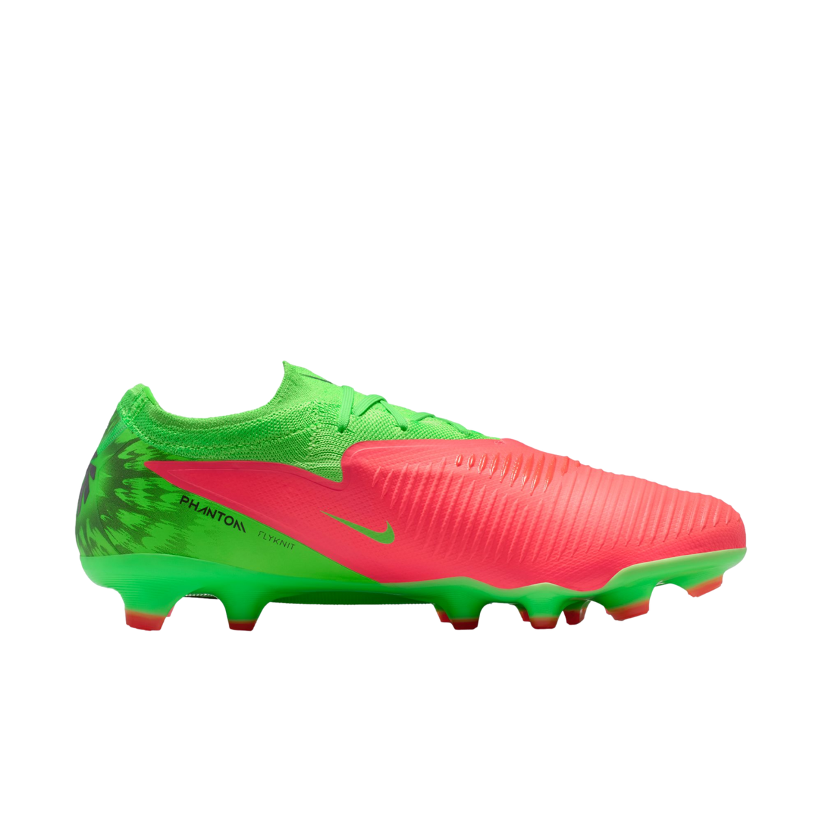 A side profile of a Nike Phantom Flyknit soccer cleat in vibrant lime green and bright coral pink, set against a solid black background.