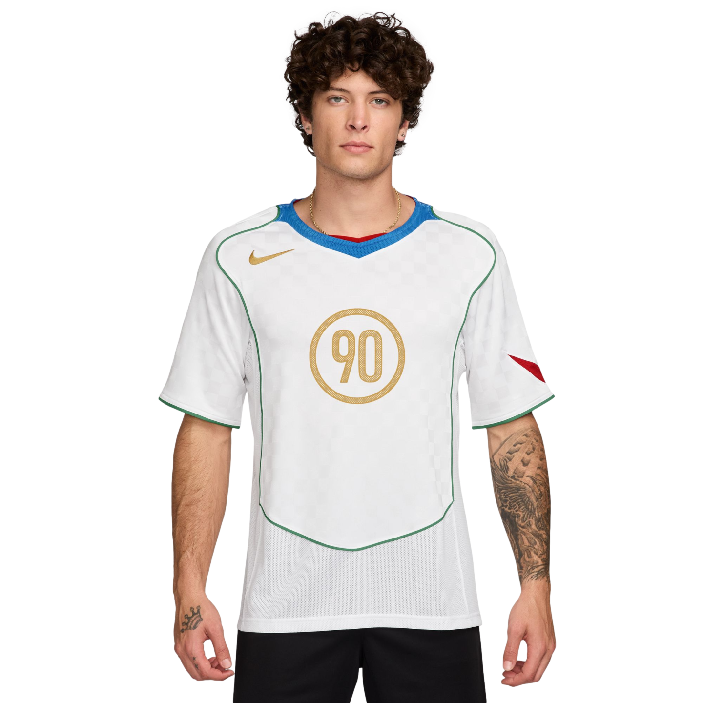 A man wearing a white Nike Total 90 soccer jersey with a gold '90' logo, green piping, and a blue neckline, posing against a plain white background.