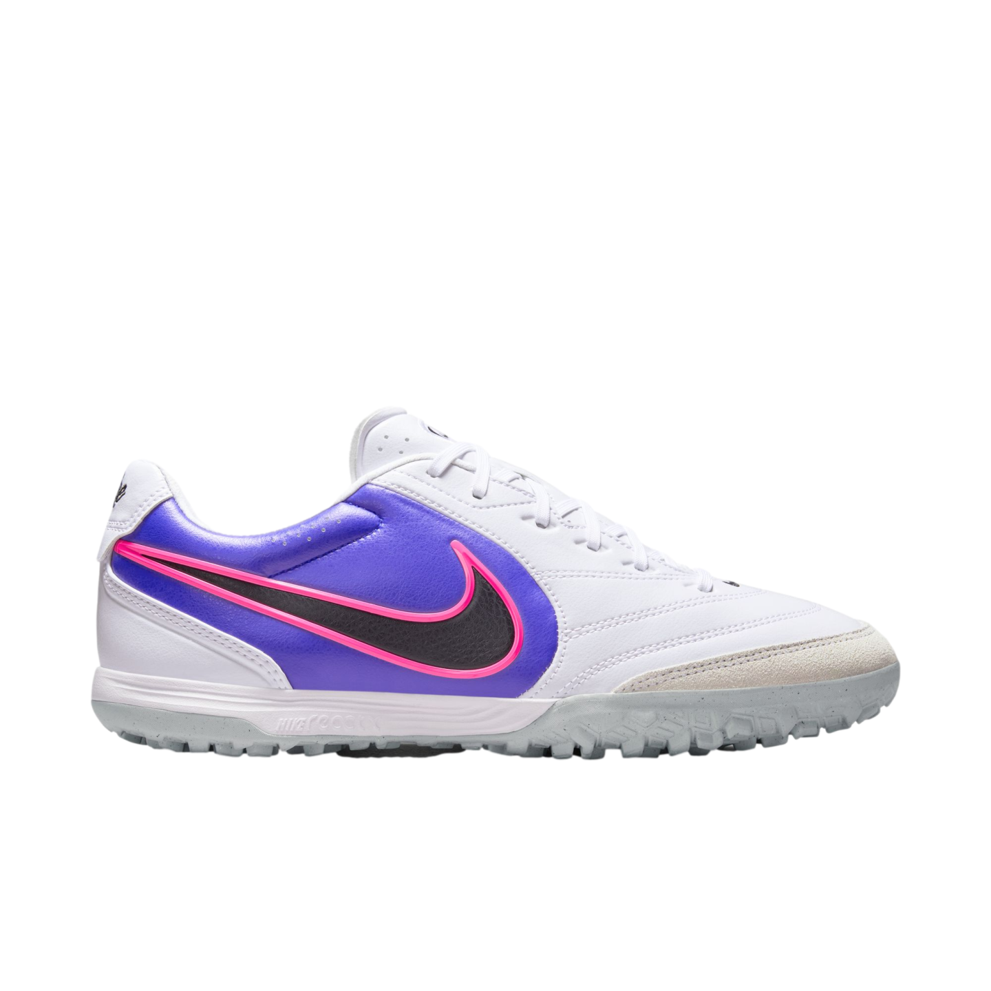 Profile of a white and purple Nike React turf soccer shoe with a black, pink-outlined Swoosh and grey studded outsole, isolated on a black background.