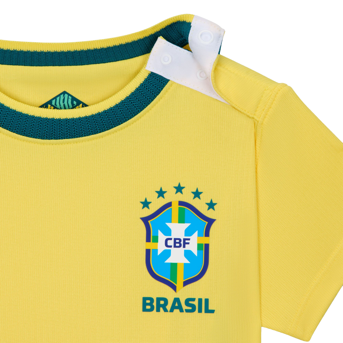 A close-up shot of a bright yellow baby-sized Brazil national football team jersey. It features a dark green ribbed neckline and a white snap-button opening on the shoulder. The official CBF crest is printed on the front with five green stars above it and