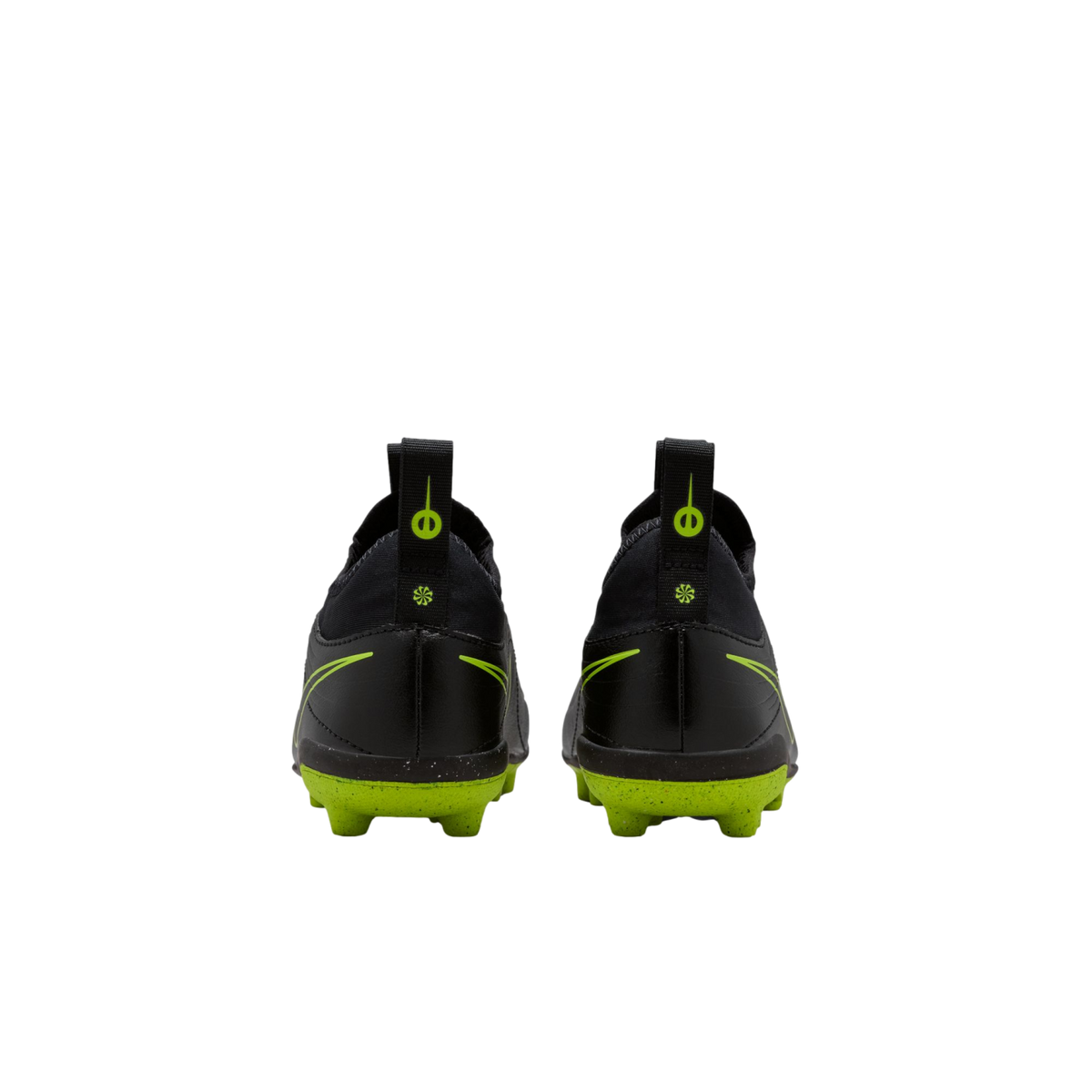 A rear view of a pair of black Nike soccer cleats with bright lime green soles and accents against a solid black background.