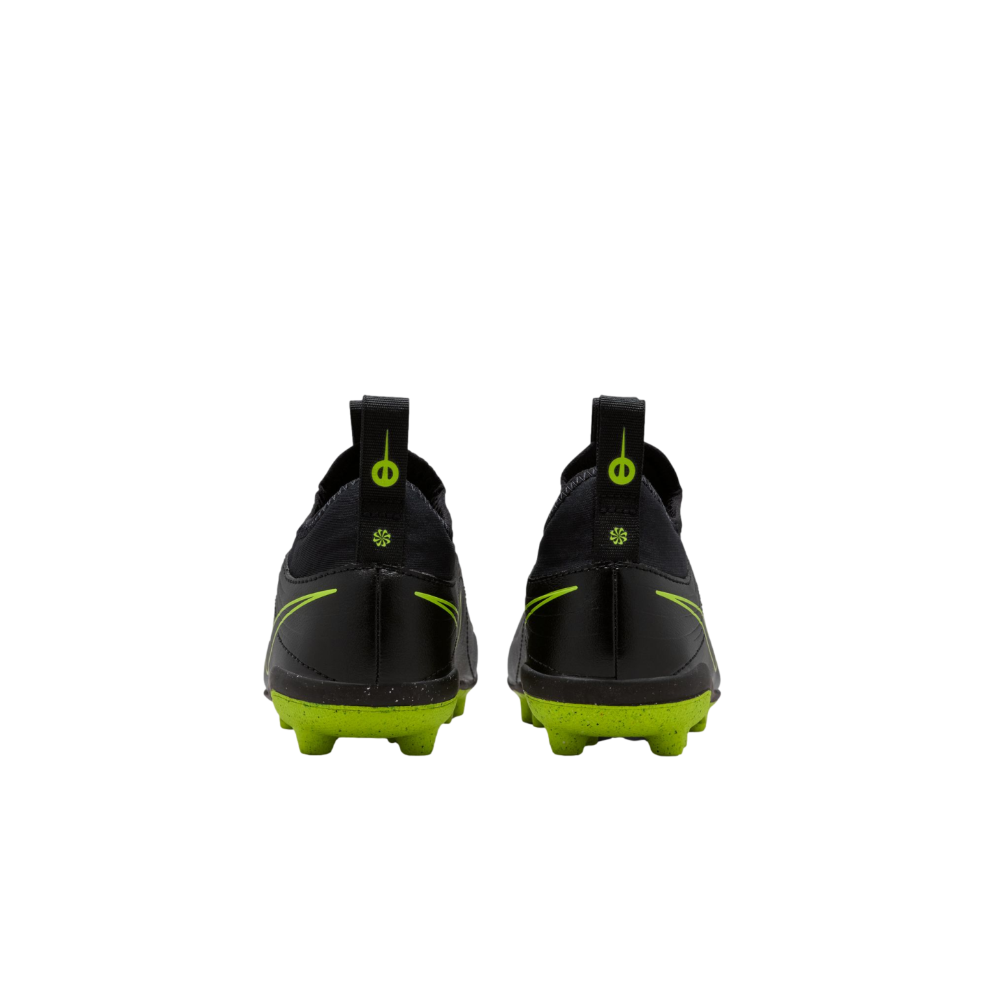 A rear view of a pair of black Nike soccer cleats with bright lime green soles and accents against a solid black background.