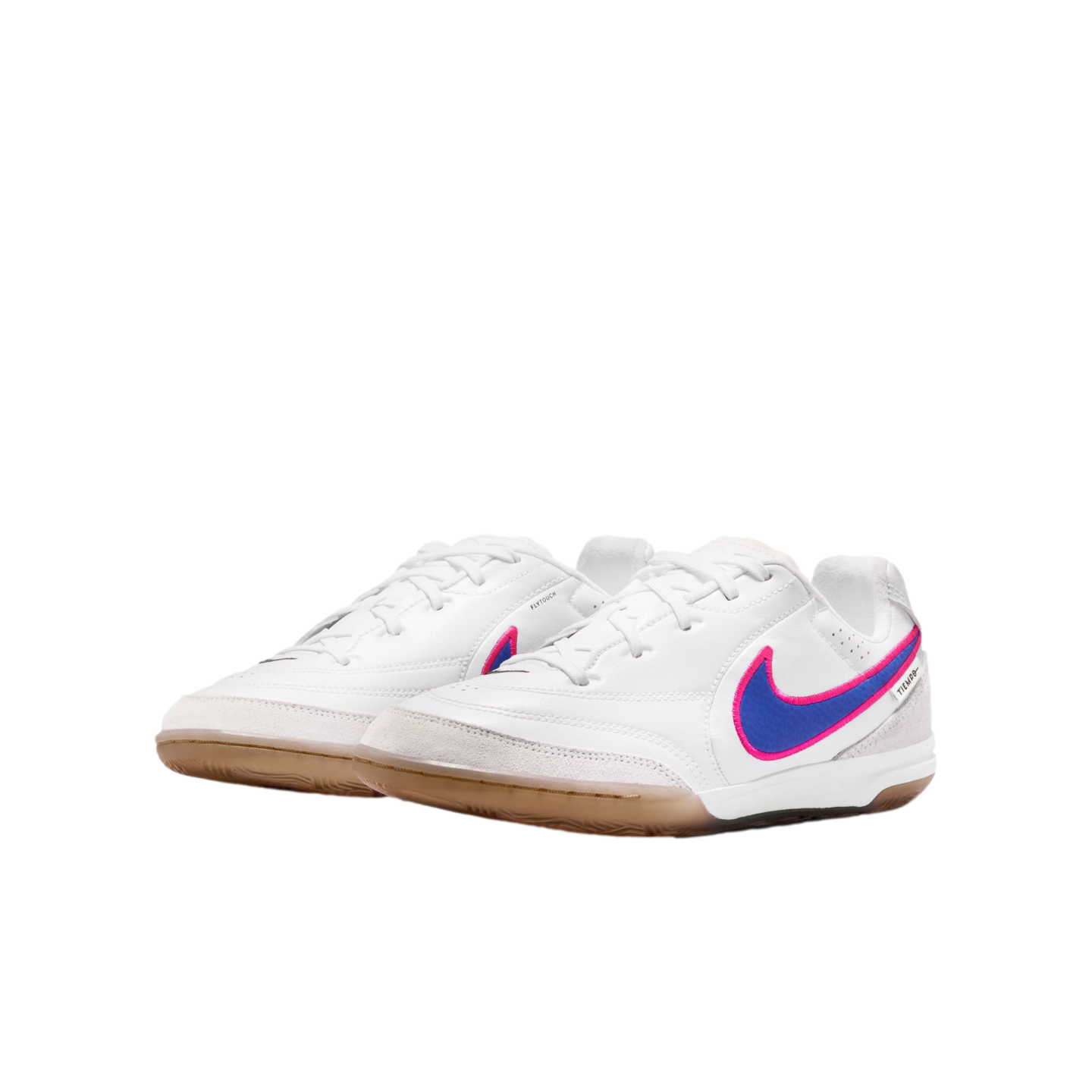 White Nike Tiempo indoor soccer shoes with blue and pink swooshes and gum soles, displayed on a black background.