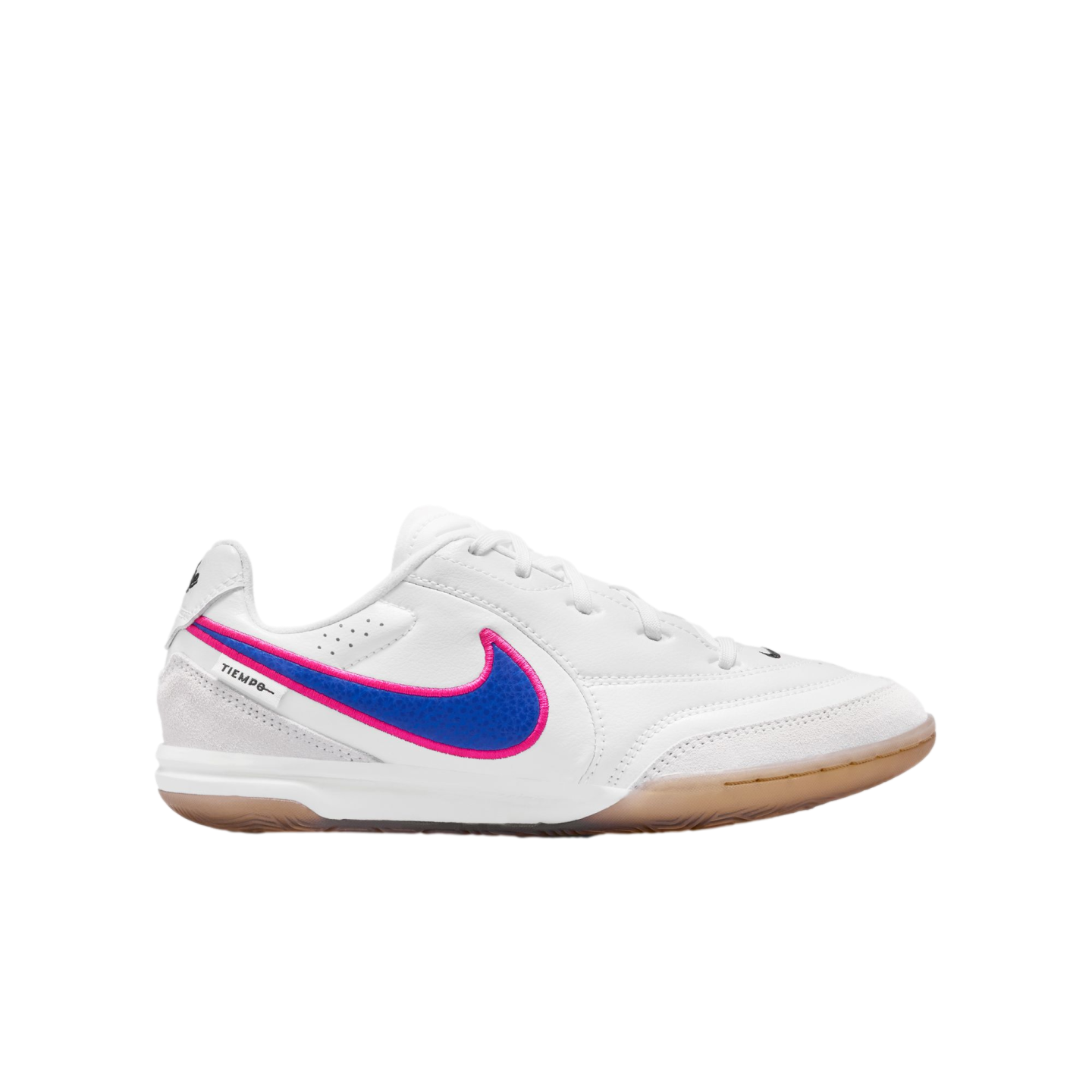 White Nike Tiempo indoor soccer shoe with a blue and pink swoosh and gum rubber sole, shown from the side against a black background.