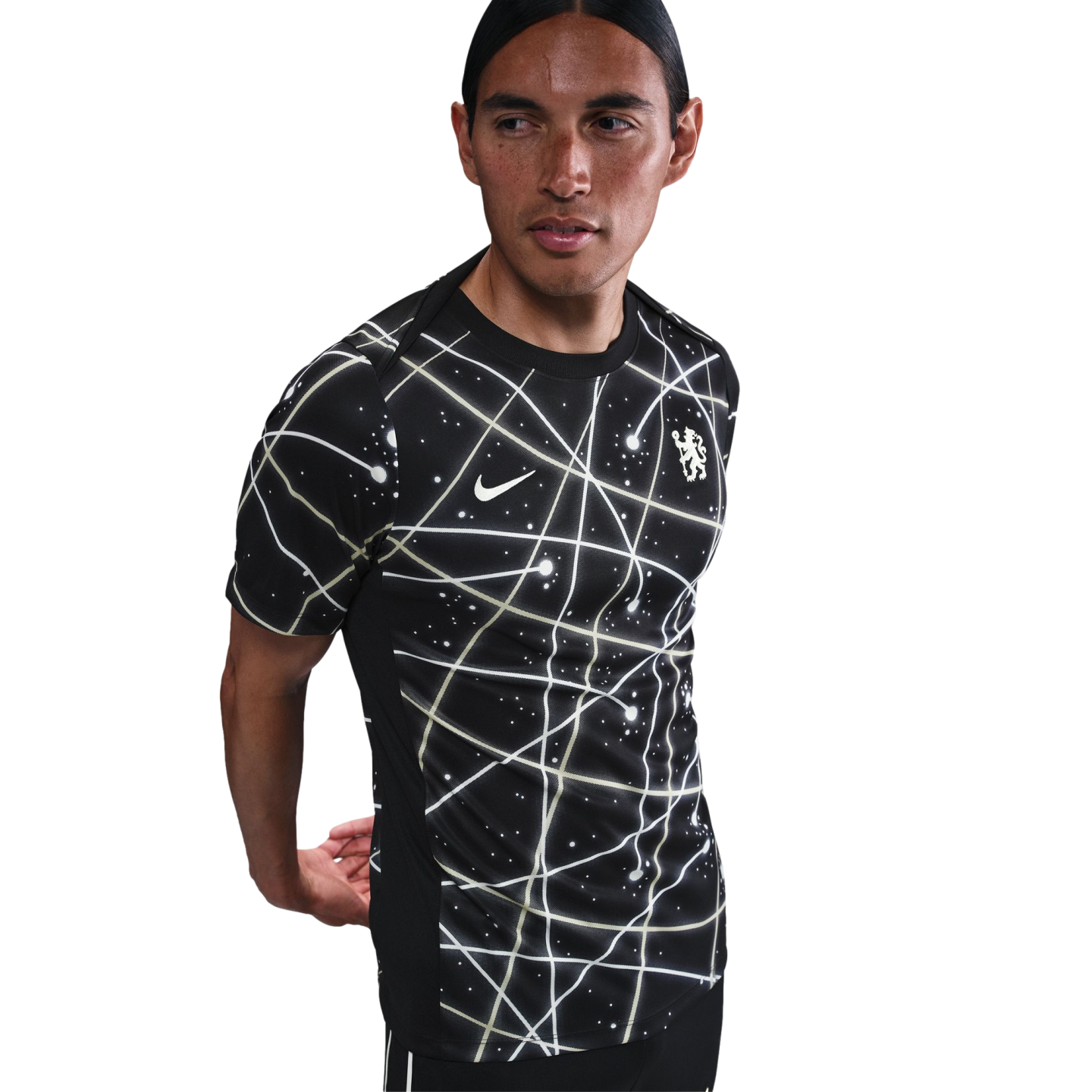 A man wearing a black Nike Chelsea FC training jersey with a white geometric pattern, posing against a plain white background.