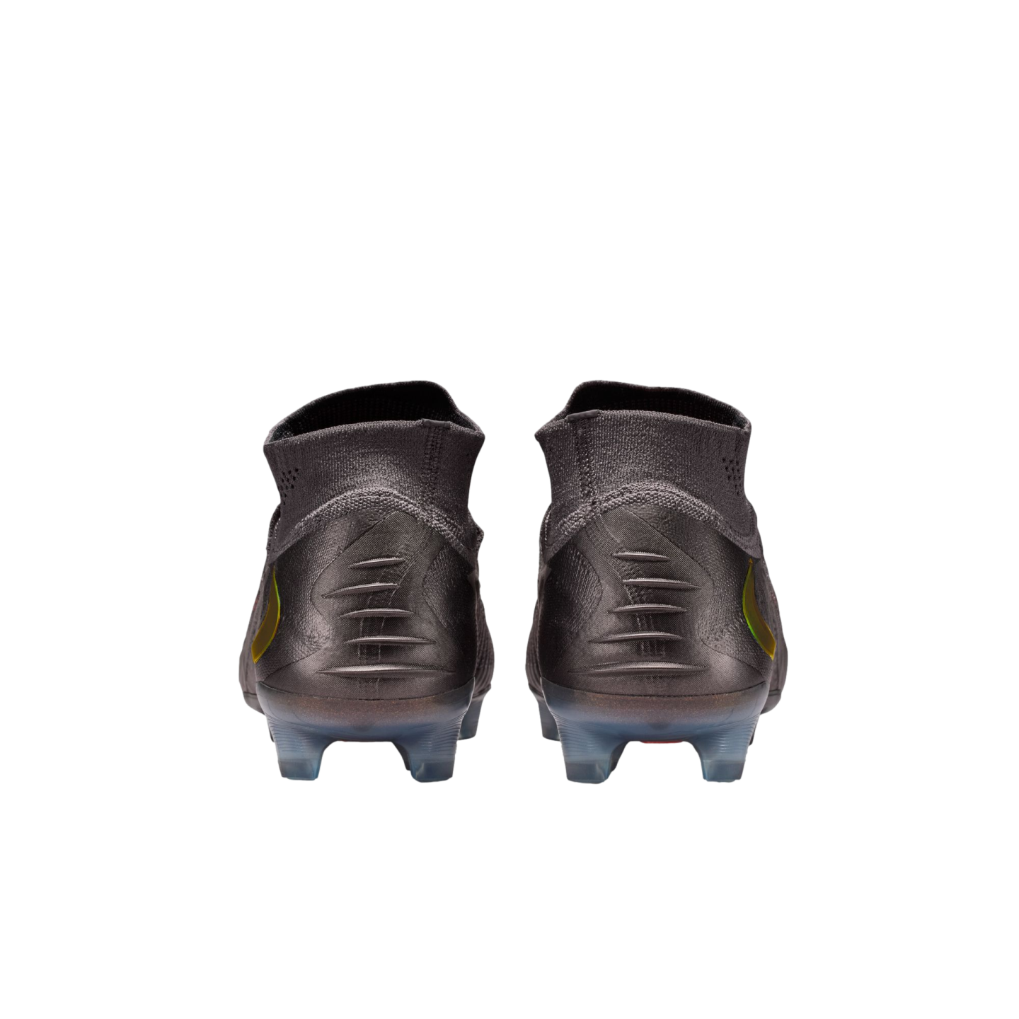 A rear view of a pair of dark grey soccer cleats with high-top knit collars, featuring five horizontal ridges on each heel and translucent studs, set against a solid black background.