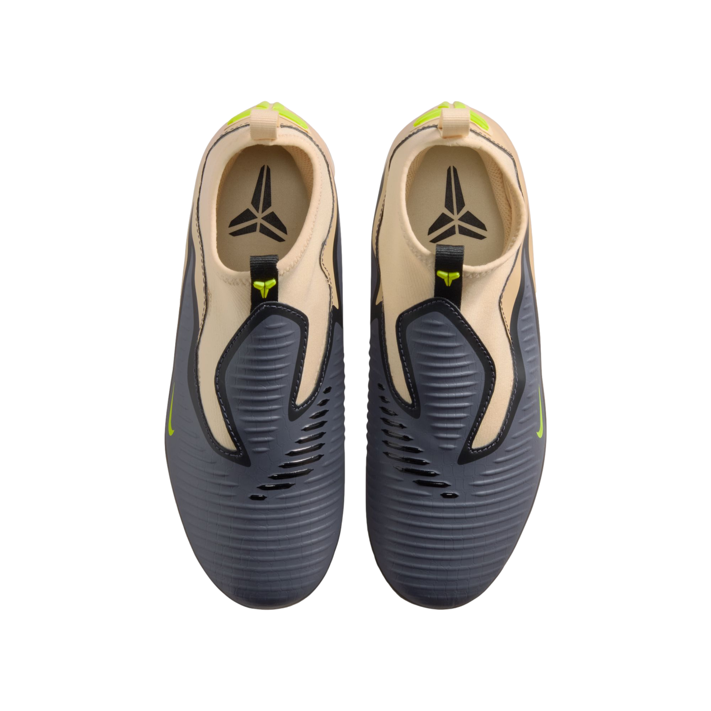 A top-down shot of grey and tan Nike Kobe slip-on sneakers with lime green details and the Kobe logo on the insoles, displayed against a black background.
